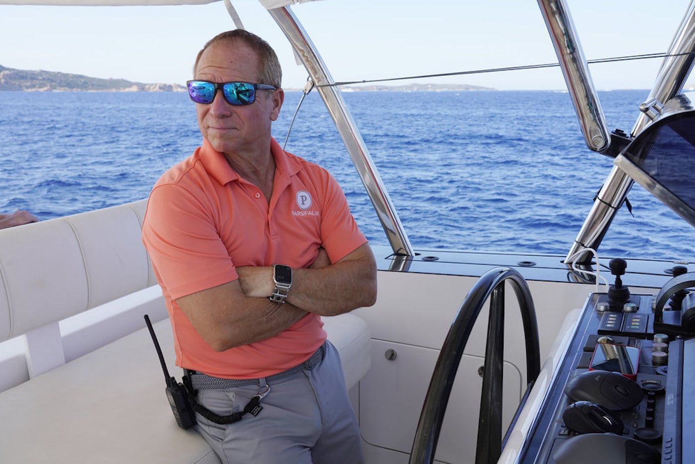 Captain Glenn Shephard from 'Below Deck Sailing Yacht' crosses his arms at the helm