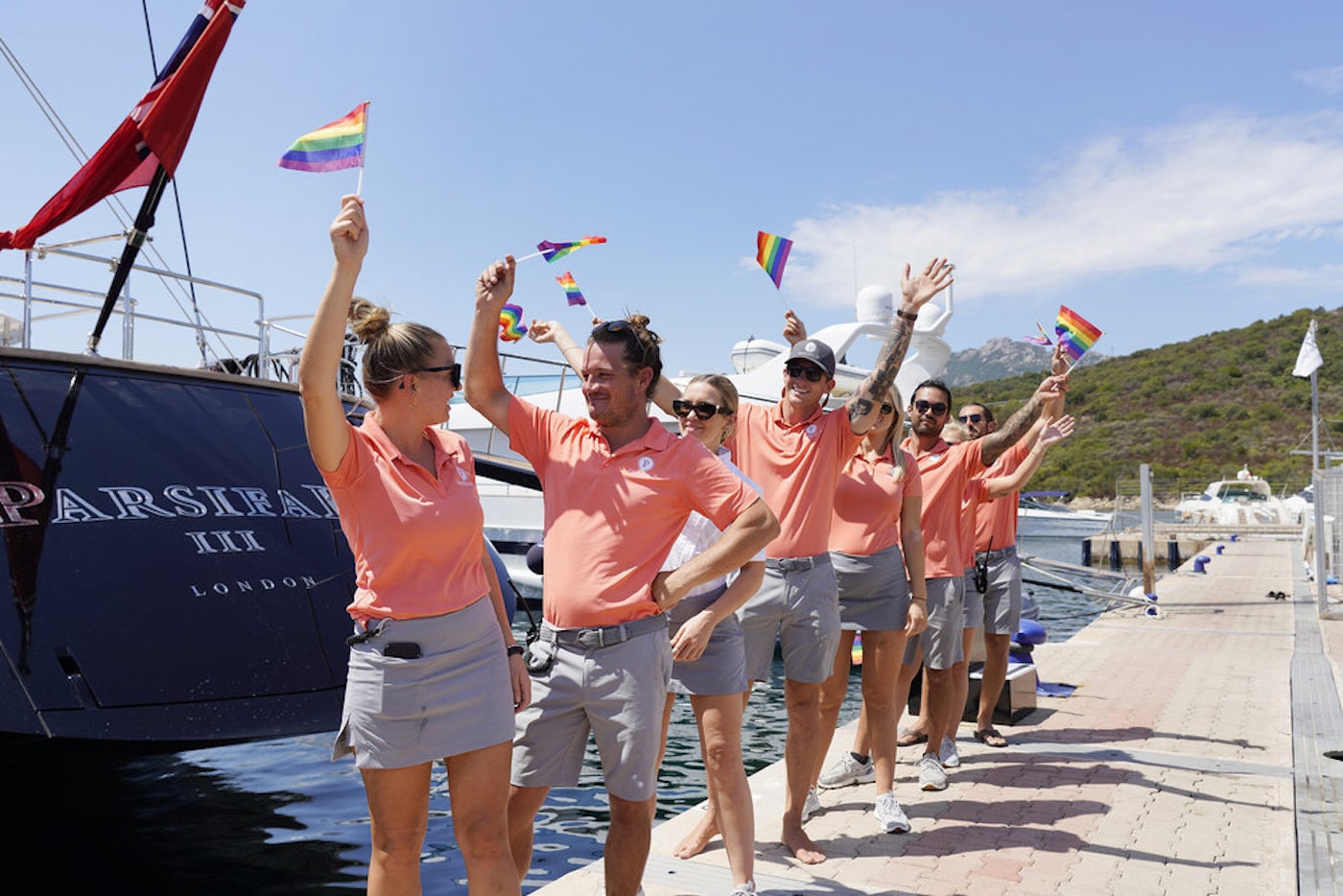 The 'Below Deck Sailing Yacht' crew hold Pride flags