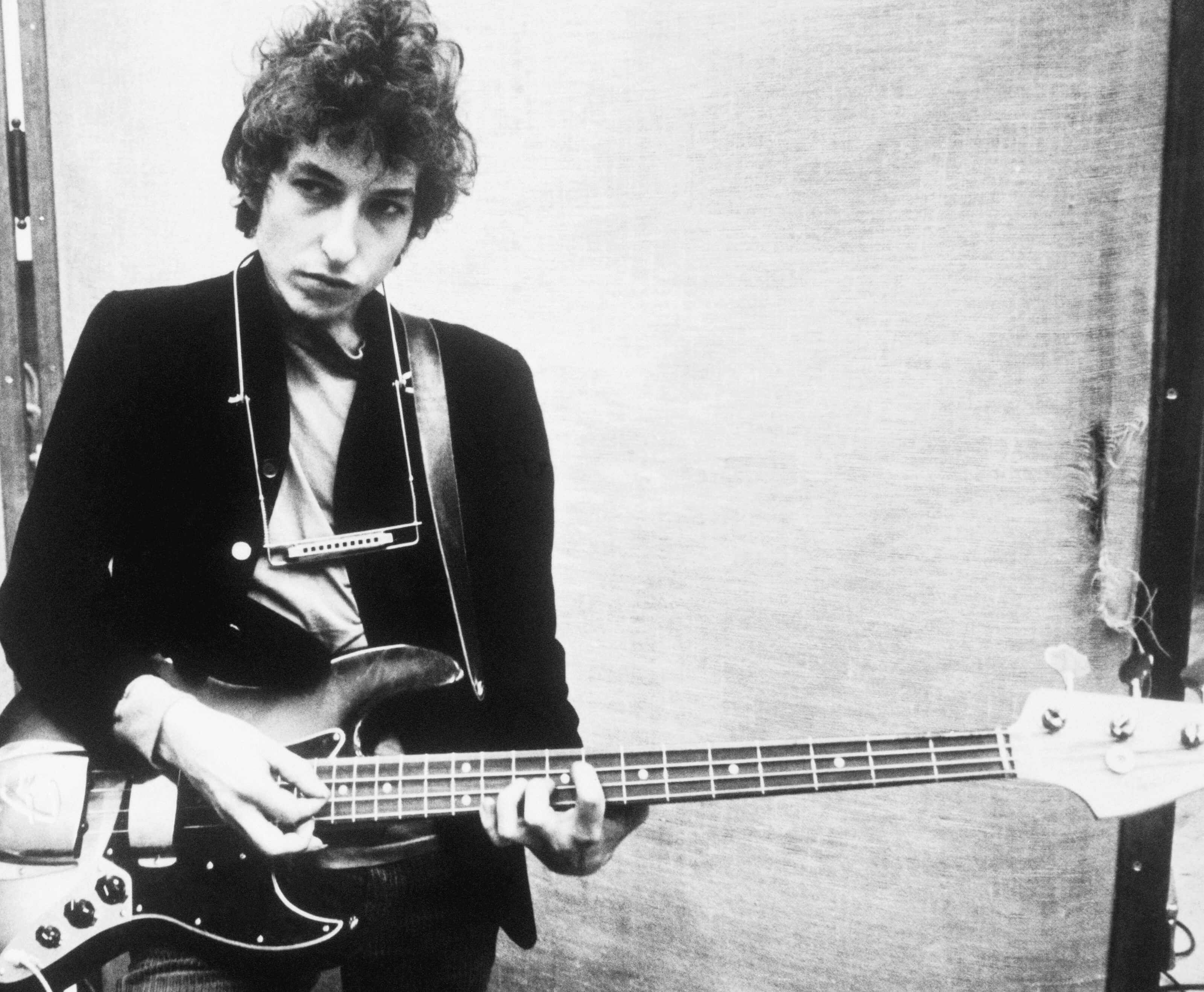 "Lay Lady Lay" singer Bob Dylan with a guitar
