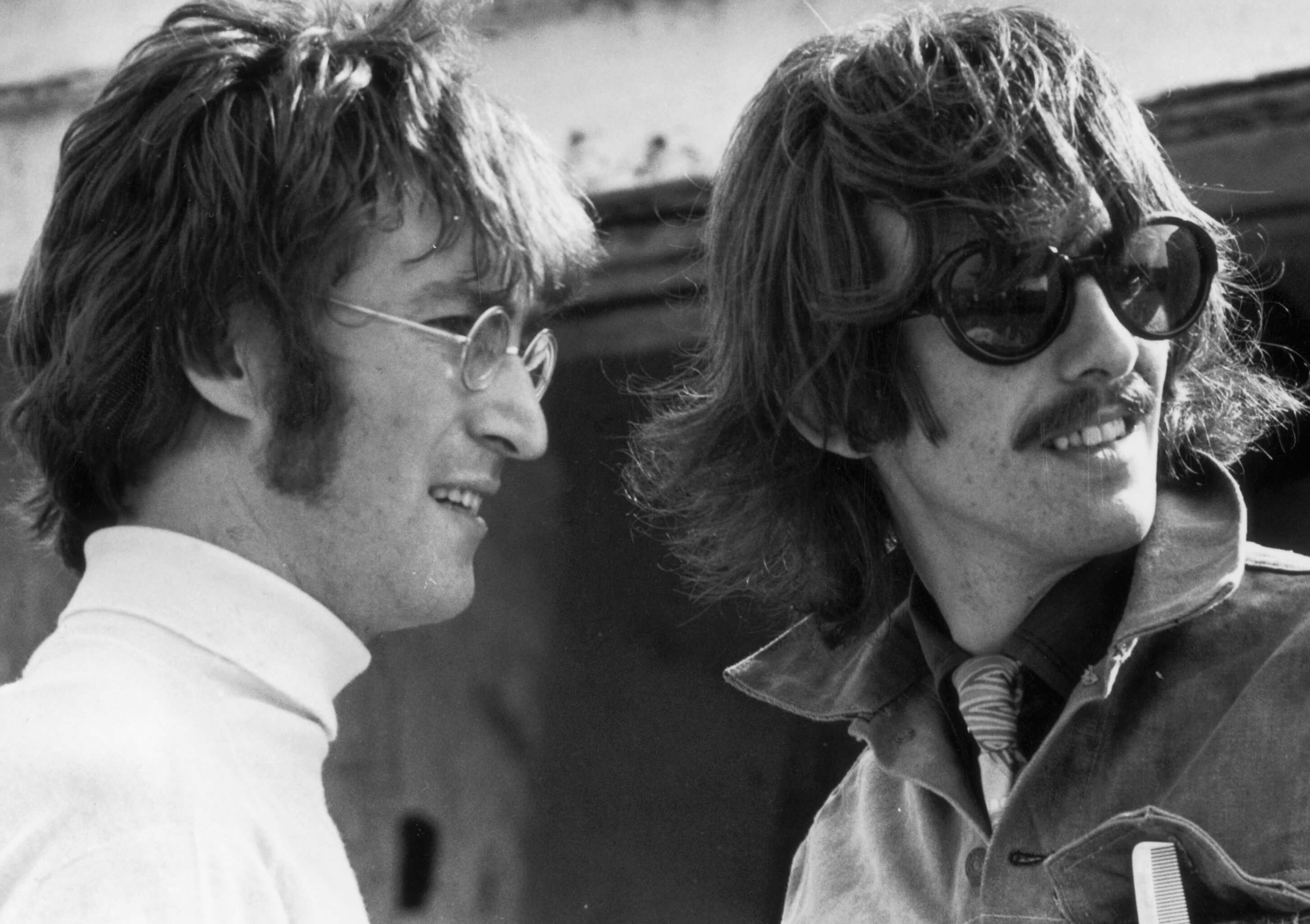 "Give Peace a Chance" singer John Lennon with George Harrison in black-and-white
