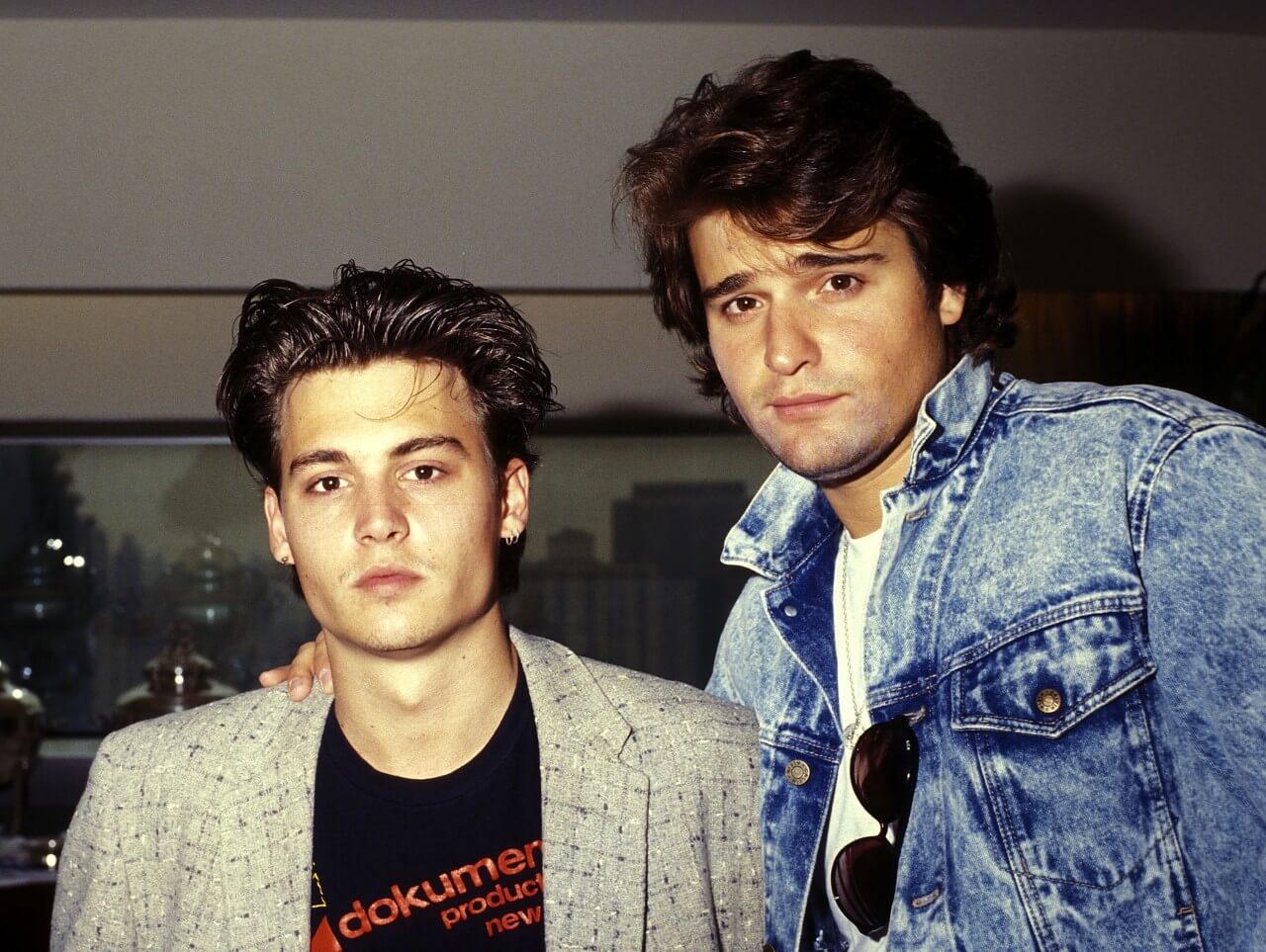 Johnny Depp and Peter DeLuise pose during a media event.