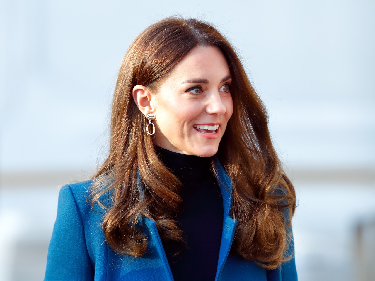 Kate Middleton poses in a royal blue blazer.