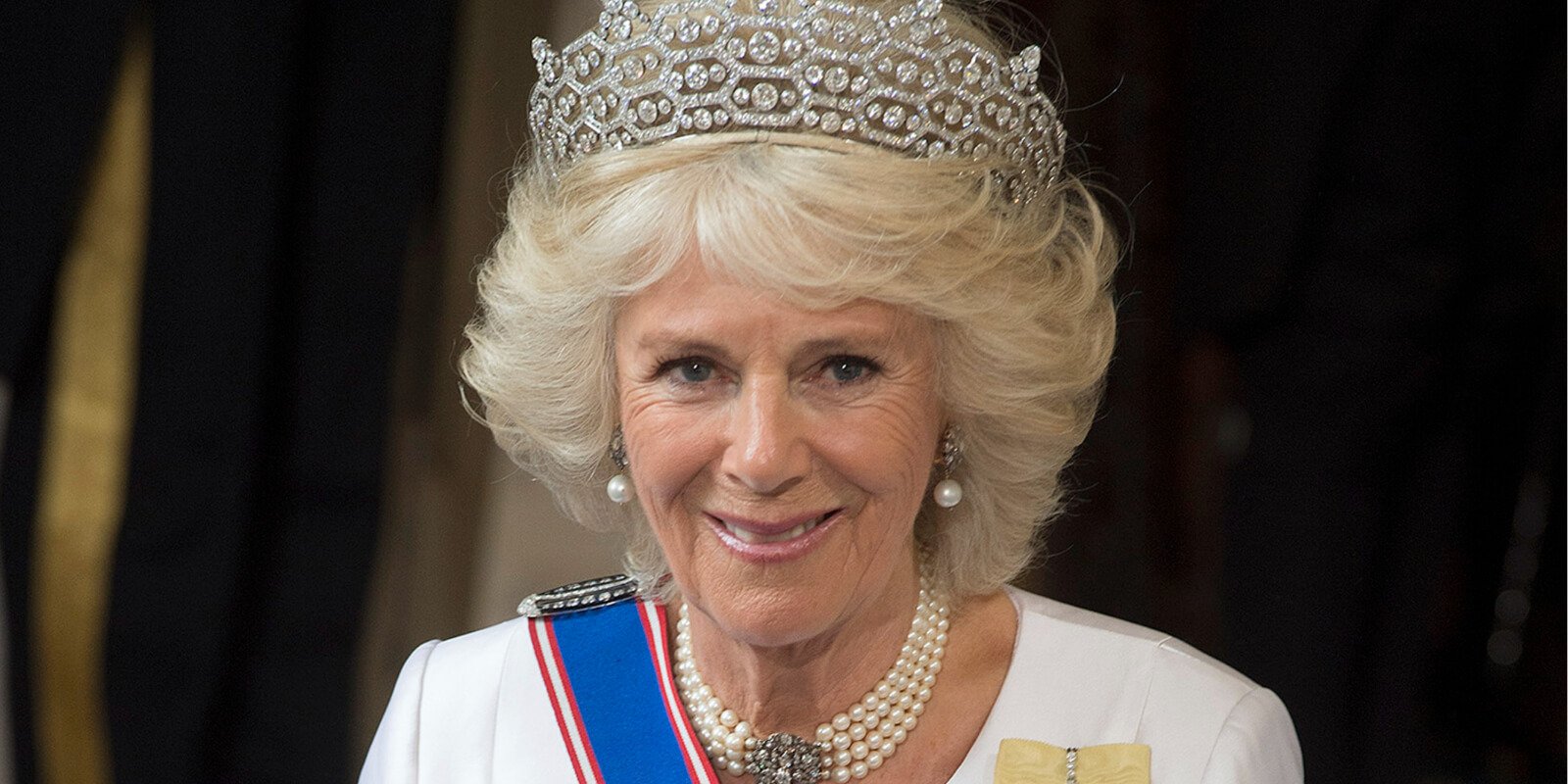 Camilla Parker Bowles dropped consort from her coronation invite, is now known as Queen Camilla.