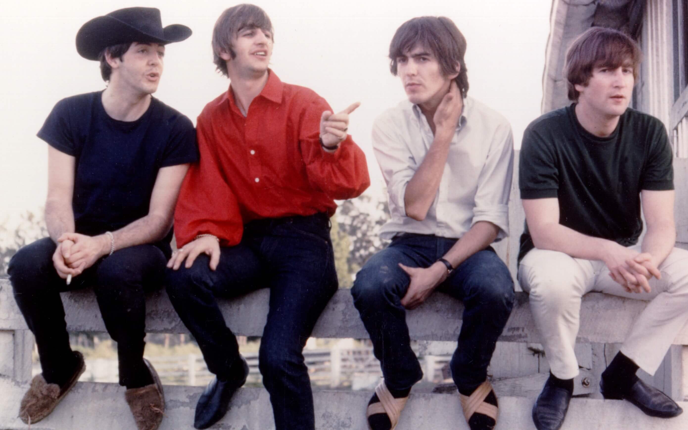 The Beatles on a fence