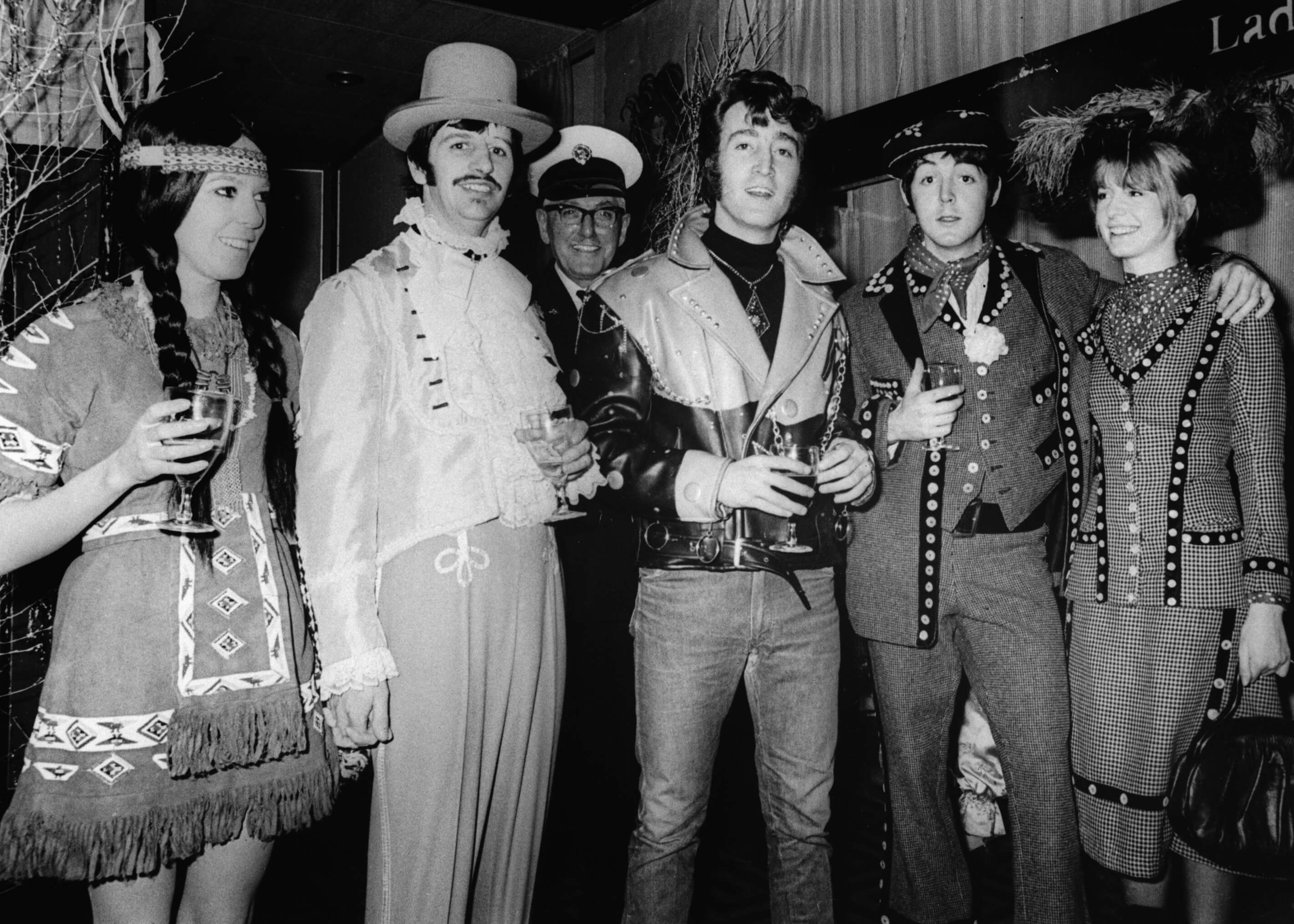 A black-and-white promo image for The Beatles' 'Magical Mystery Tour'