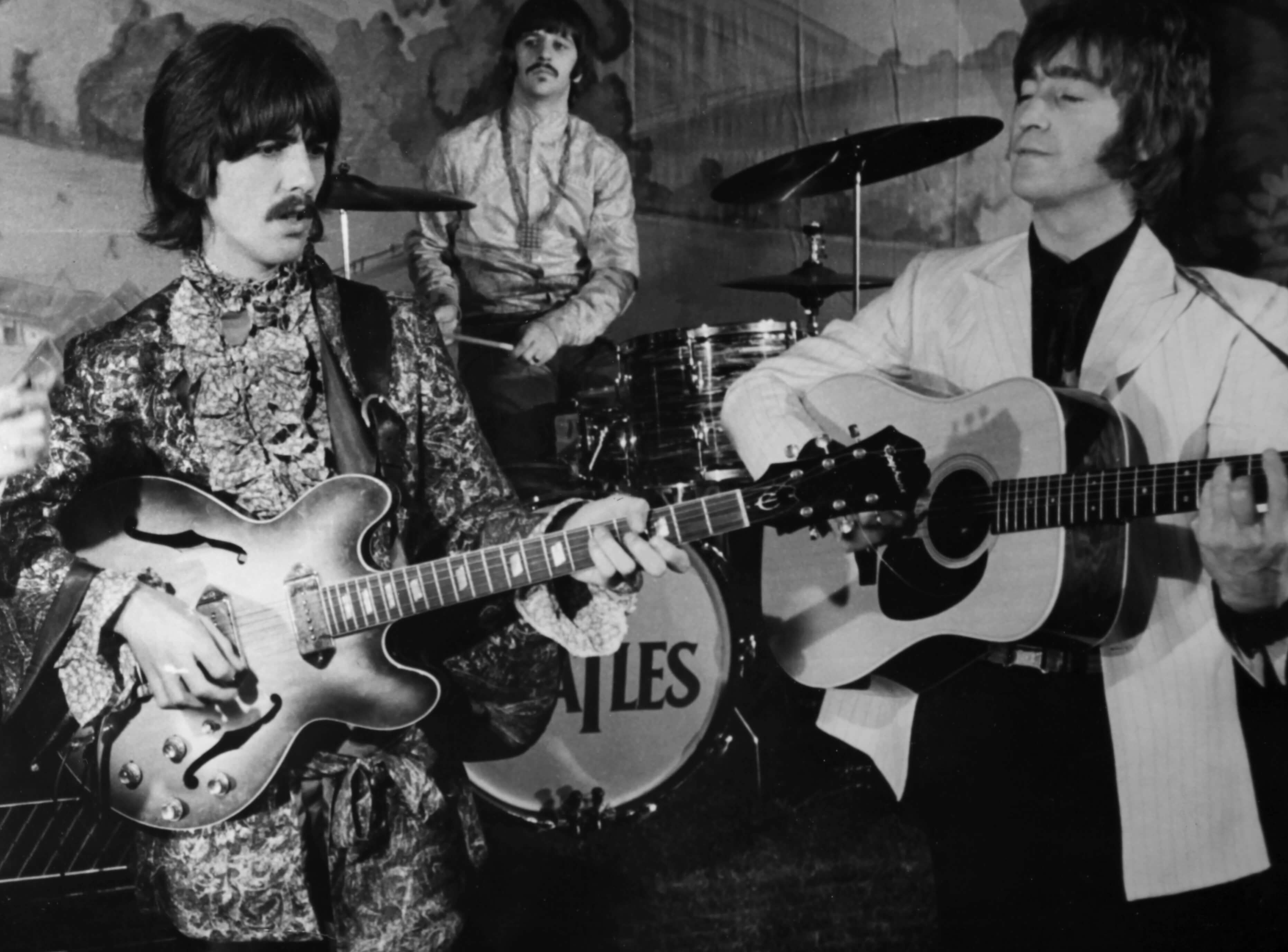 "Tomorrow Never Knows" era Beatles with guitars