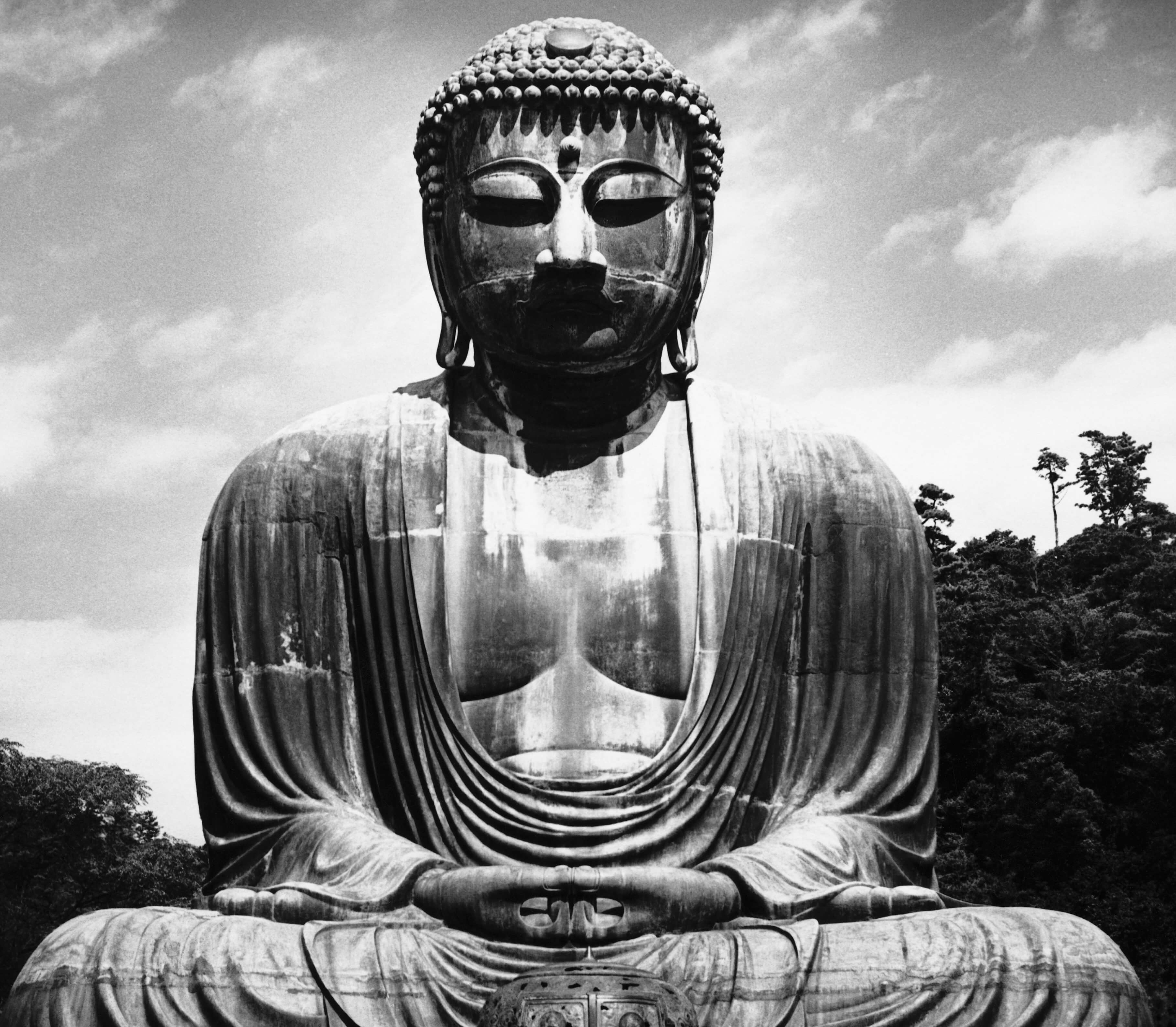 A statue of Buddha in black-and-white