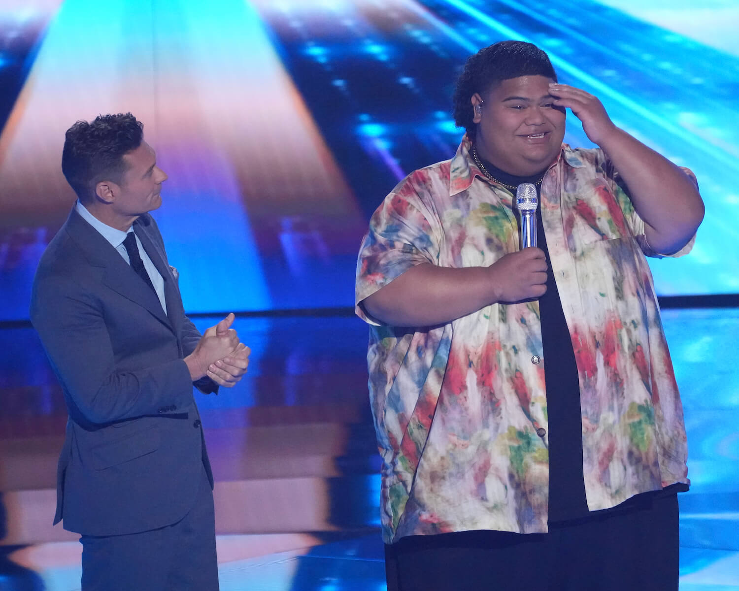 Iam Tongi with Ryan Seacrest on stage. Iam made it into the 'American Idol' 2023 Judges Song Contest