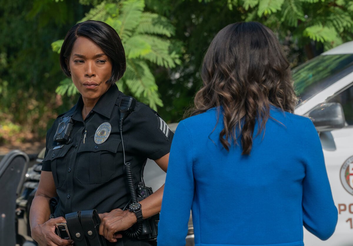 Angela Bassett in a police uniform looking at a woman in blue in '9-1-1' on Fox