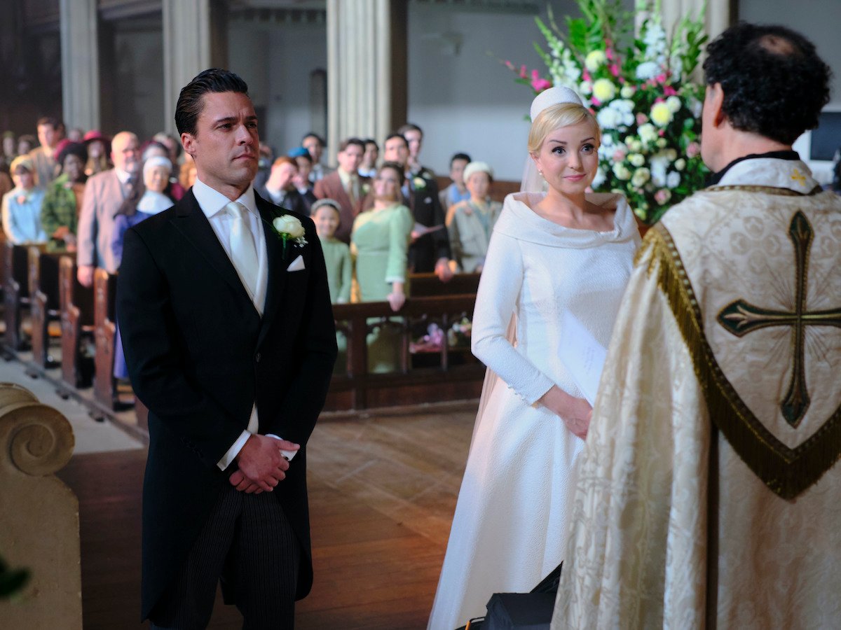 Matthew (Olly Rix) and Trixie (Helen George) standing at their altar at their wedding in 'Call the Midwife' Season 12 finale