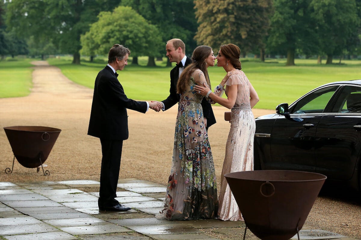 David Rocksavage, Prince William, Rose Hanbury, and Kate Middleton shake hands and kiss on the cheek at a charity gala