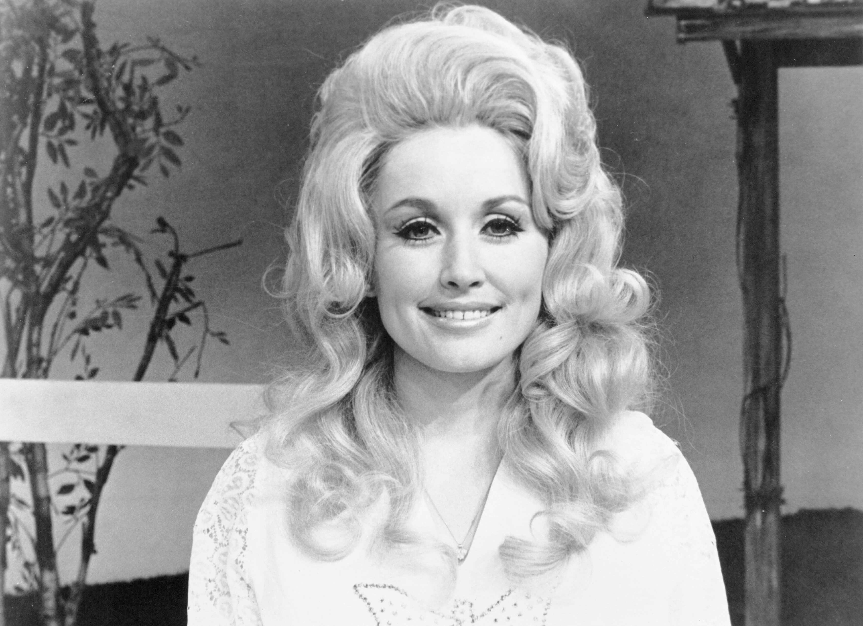 Dolly Parton poses for a picture. 