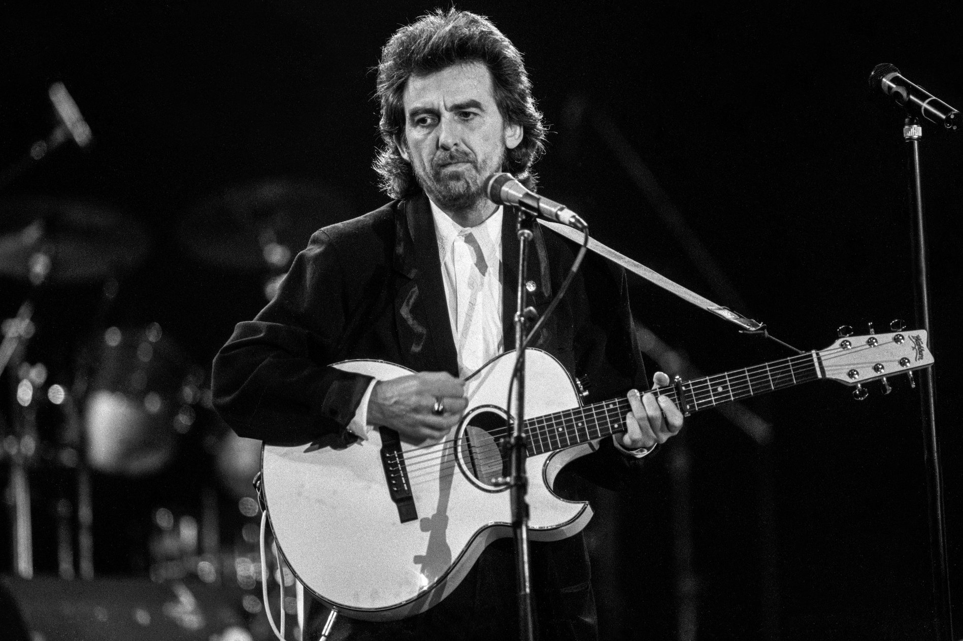 George Harrison performs at the Prince's Trust Concert in London in 1987