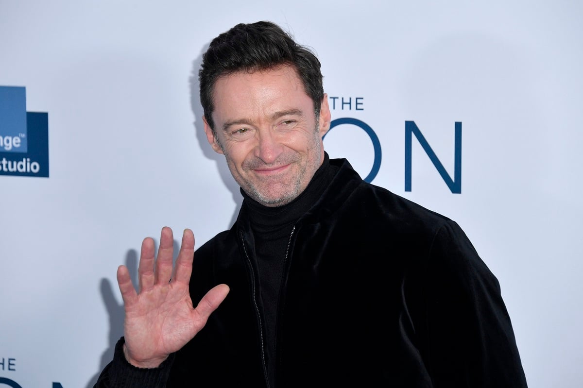 Hugh Jackman taking a photo at the premiere of the movie 'The Son.'