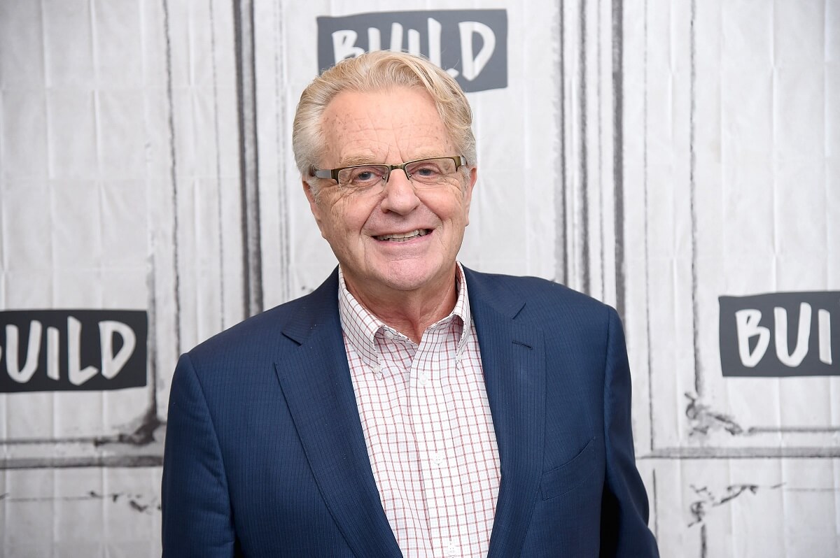 Jerry Springer smiling while visiting the set of the 'Build' series.