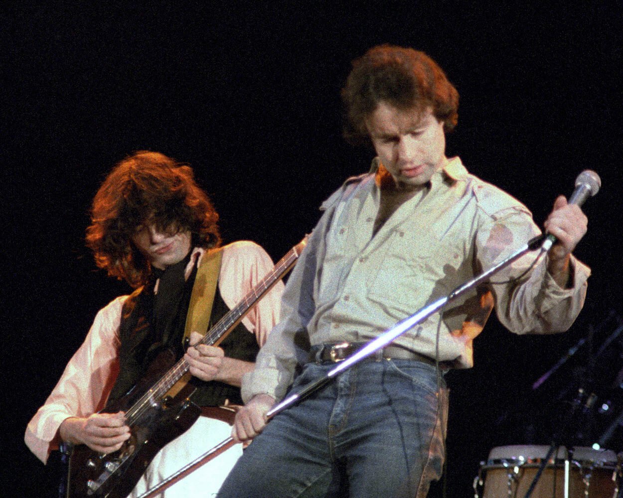 Jimmy Page (left) playing guitar and Paul Rodgers holding a microphone stand during an ARMS (Action into Research for Multiple Sclerosis) benefit concert.