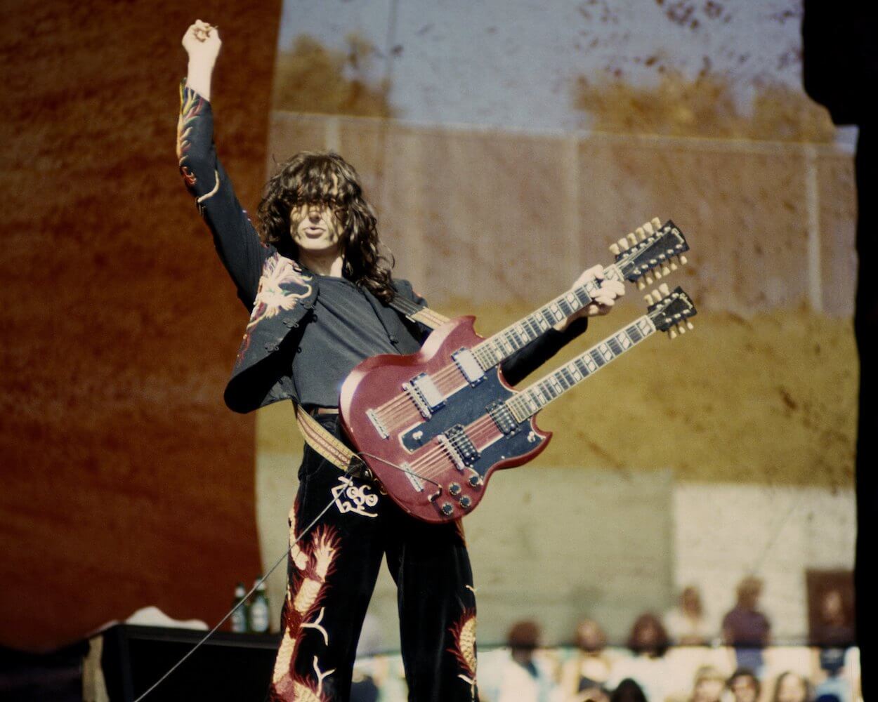 Jimmy Page wears his black suit with red dragons while playing double-necked guitar at a 1977 concert in Oakland, California.