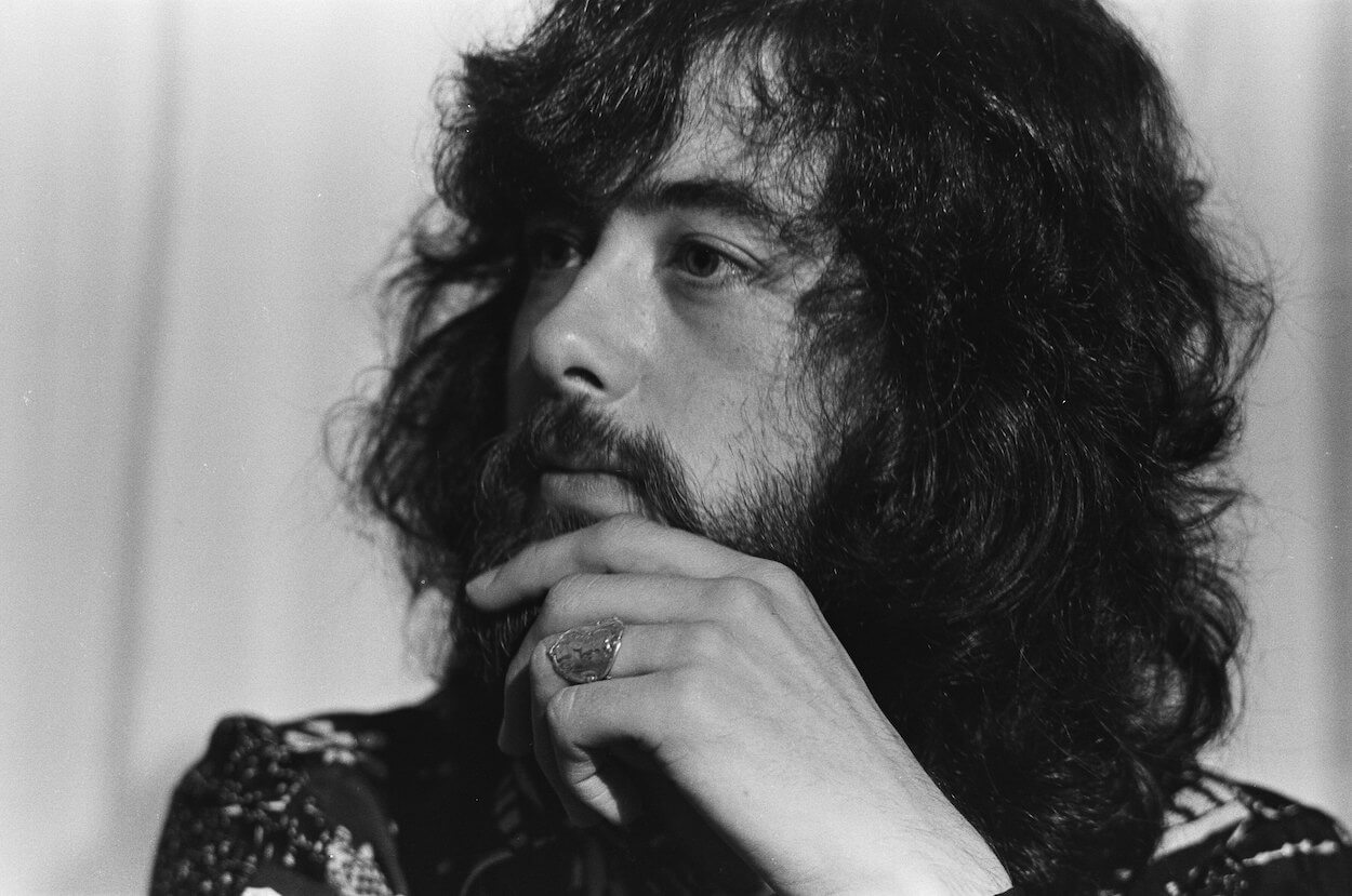 Led Zeppelin guitarist Jimmy Page sports a beard and looks to his right during a press conference in 1970.