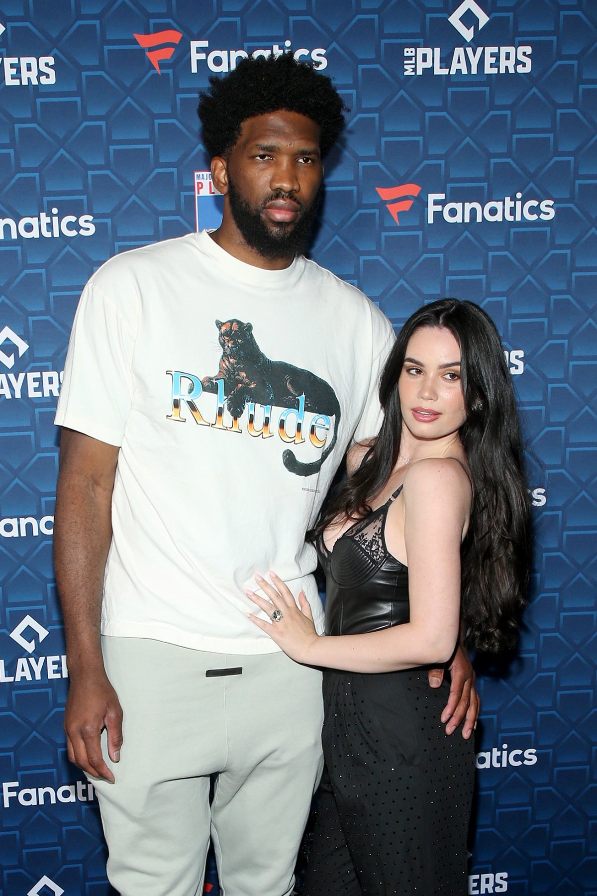 Joel Embiid and Anne de Paula pose on the carpet together at the “Players Party”