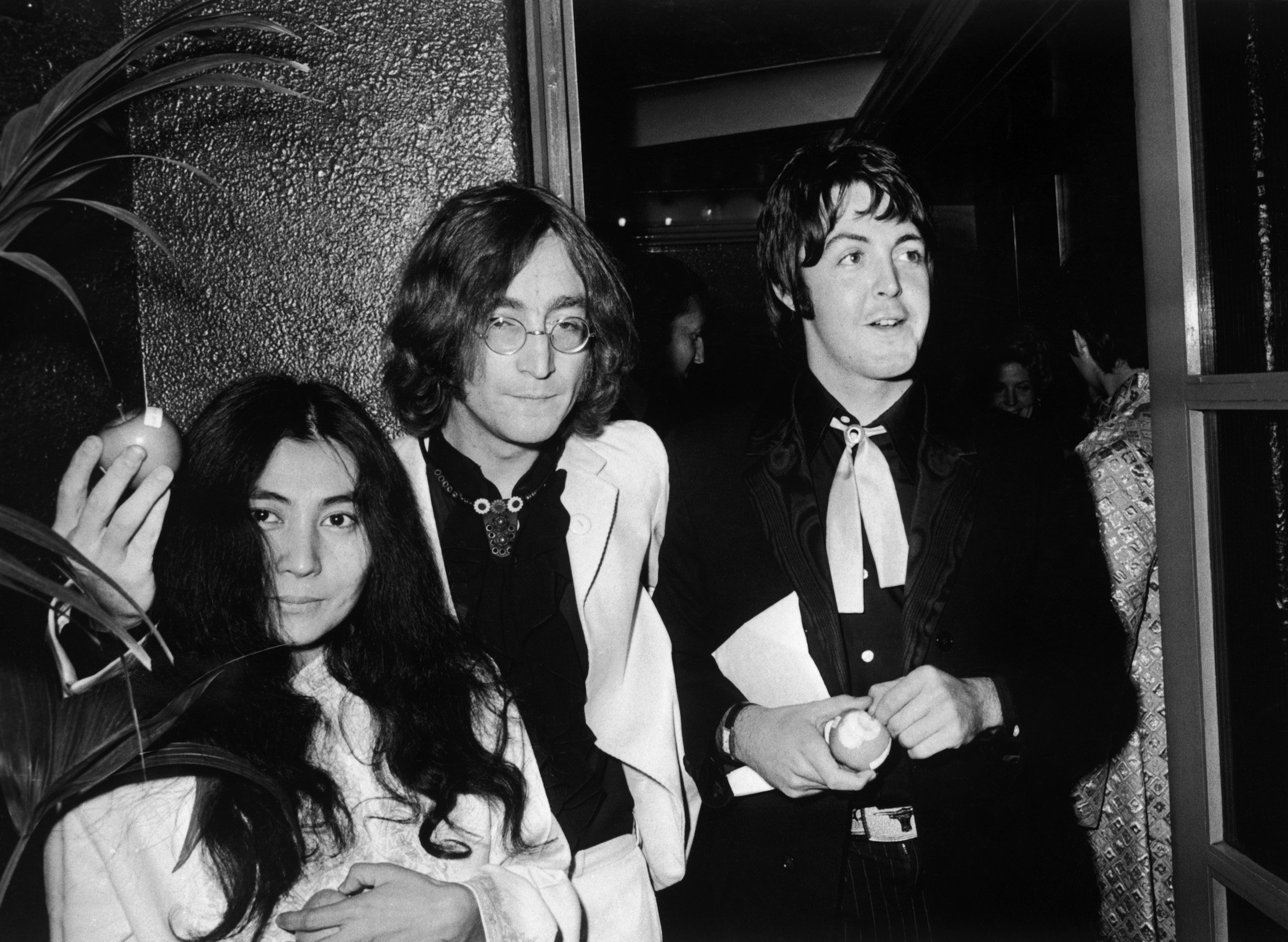 Yoko Ono, John Lennon, and Paul McCartney attend the premiere of Yellow Submarine at the London Pavilion in 1968