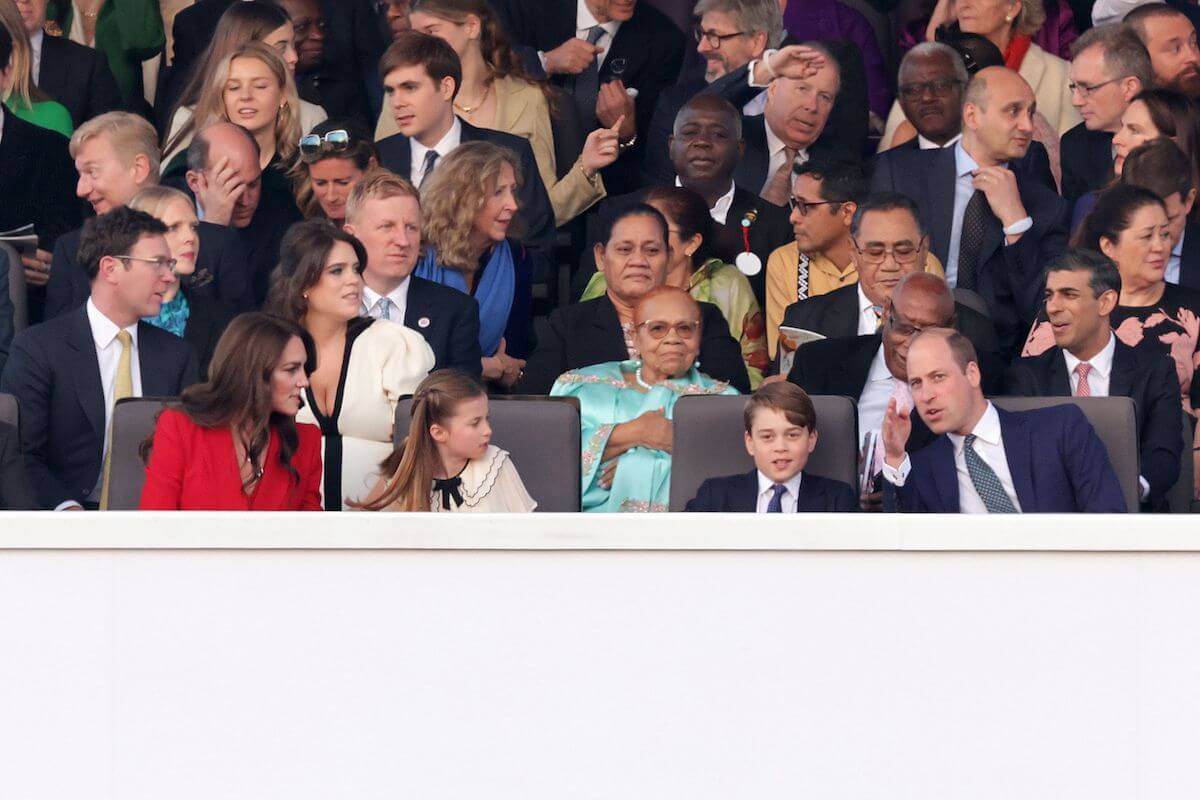 Kate Middleton, who sent a 'sweet message' to King Charles with her necklace at the coronation concert, sits with Princess Charlotte, Prince George, and Prince William