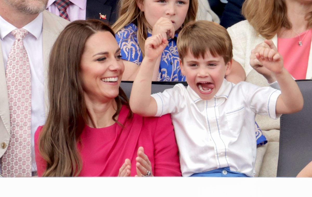 Kate Middleton sitting next to her son, Prince Louis, who is cheering during the Platinum Pageant