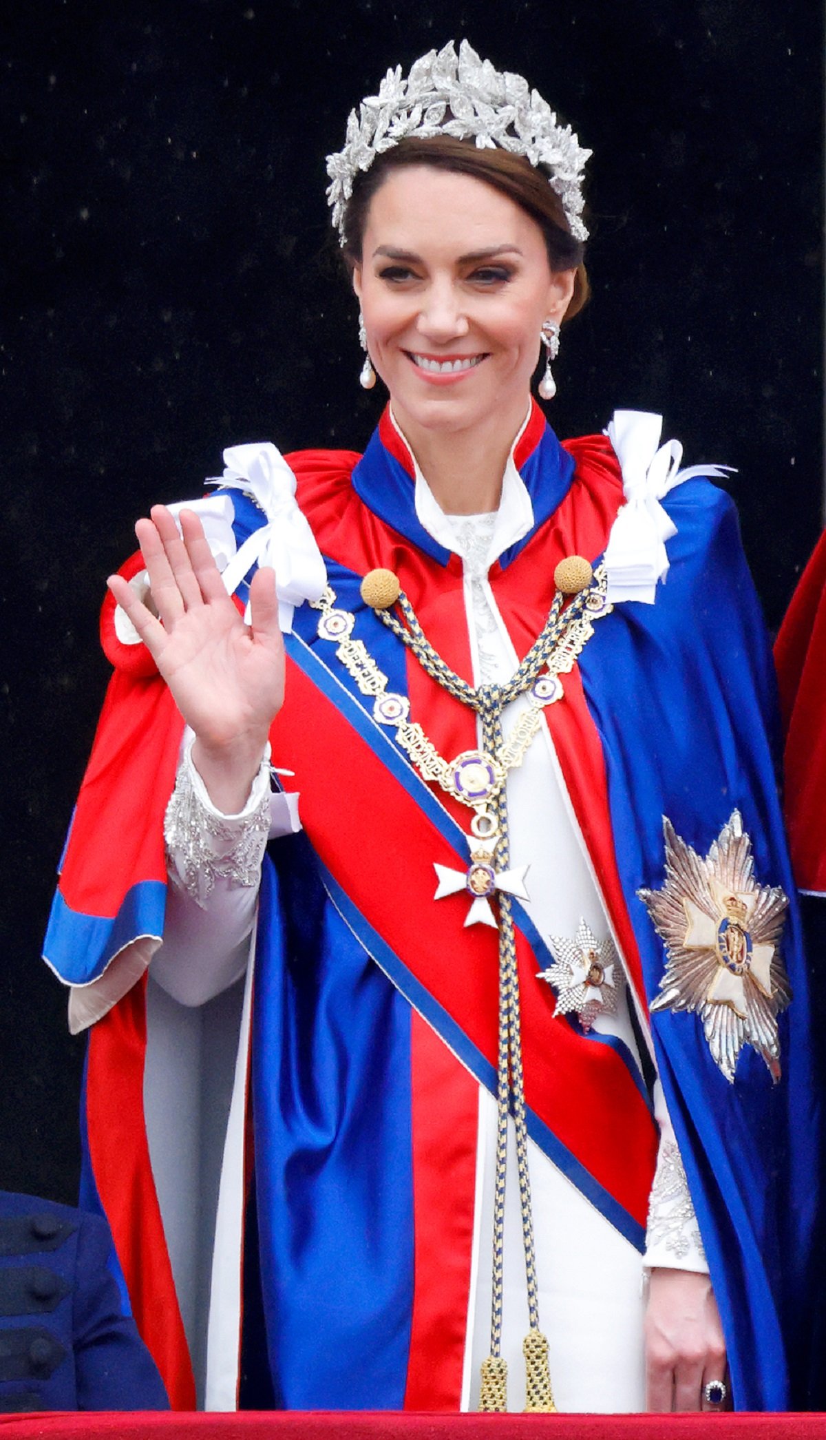 Kate Middleton waving from the balcony of Buckingham Palace following the coronation of King Charles III