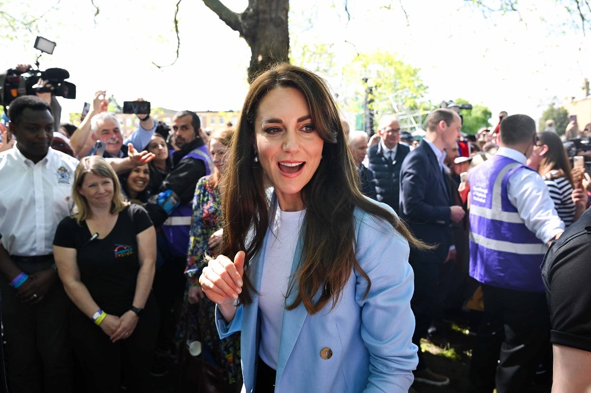 Kate Middleton, who a body language expert says reminded everyone of Princess Diana during Eurovsion appearance, takes a walkabout at The Big Lunch in Windsor