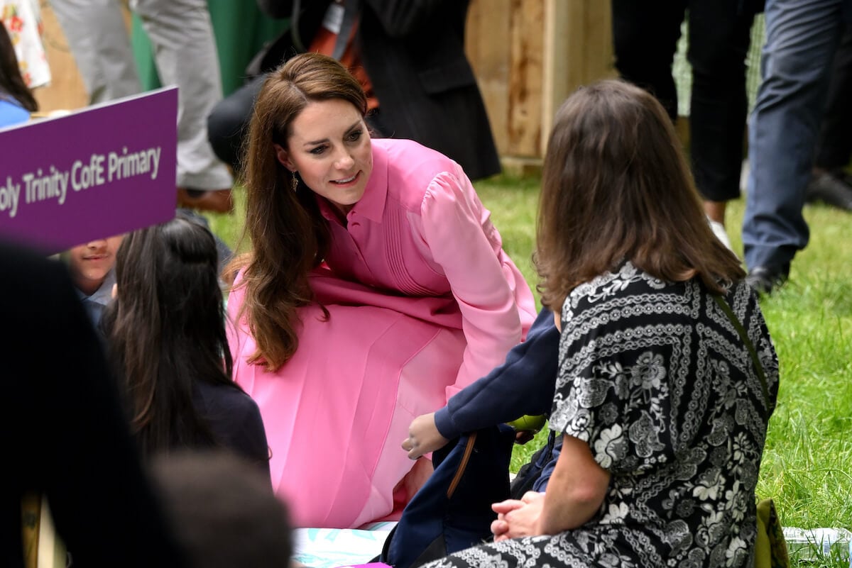 Kate Middleton, who refused kids' autograph requests at the Chelsea Flower Show, looks on