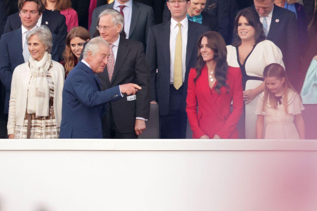 Kate Middleton, who wore a good luck charm at the coronation concert, stands with King Charles III and Princess Charlotte