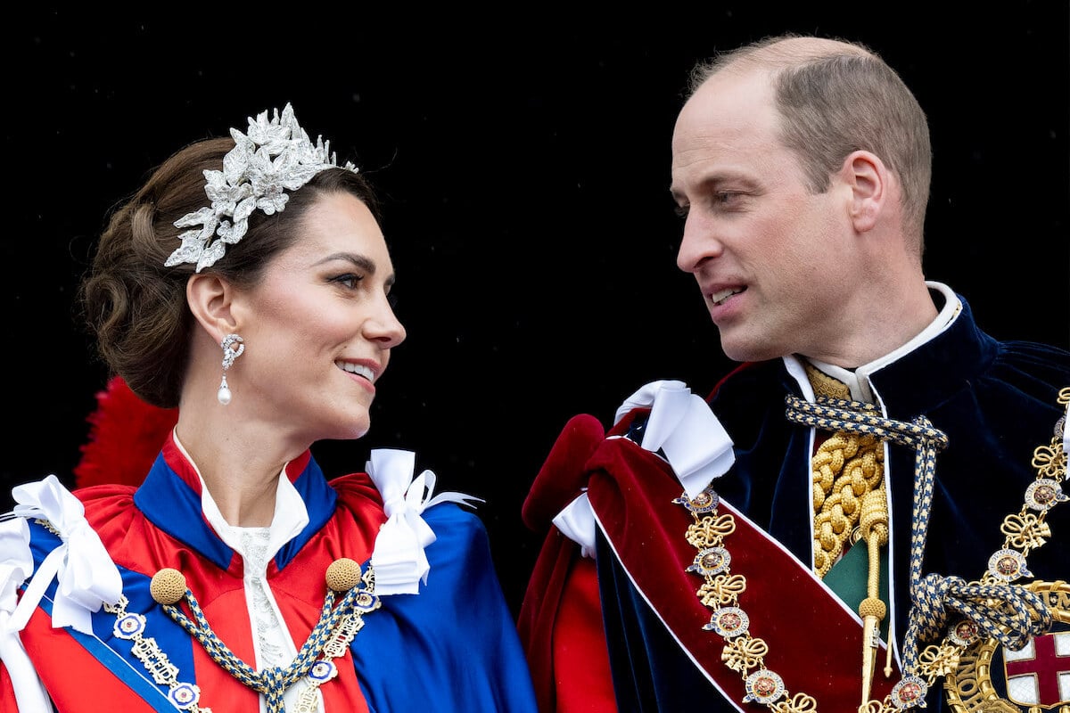 Kate Middleton, whose coronation gown disappointed a royal fashion expert, and Prince William look on