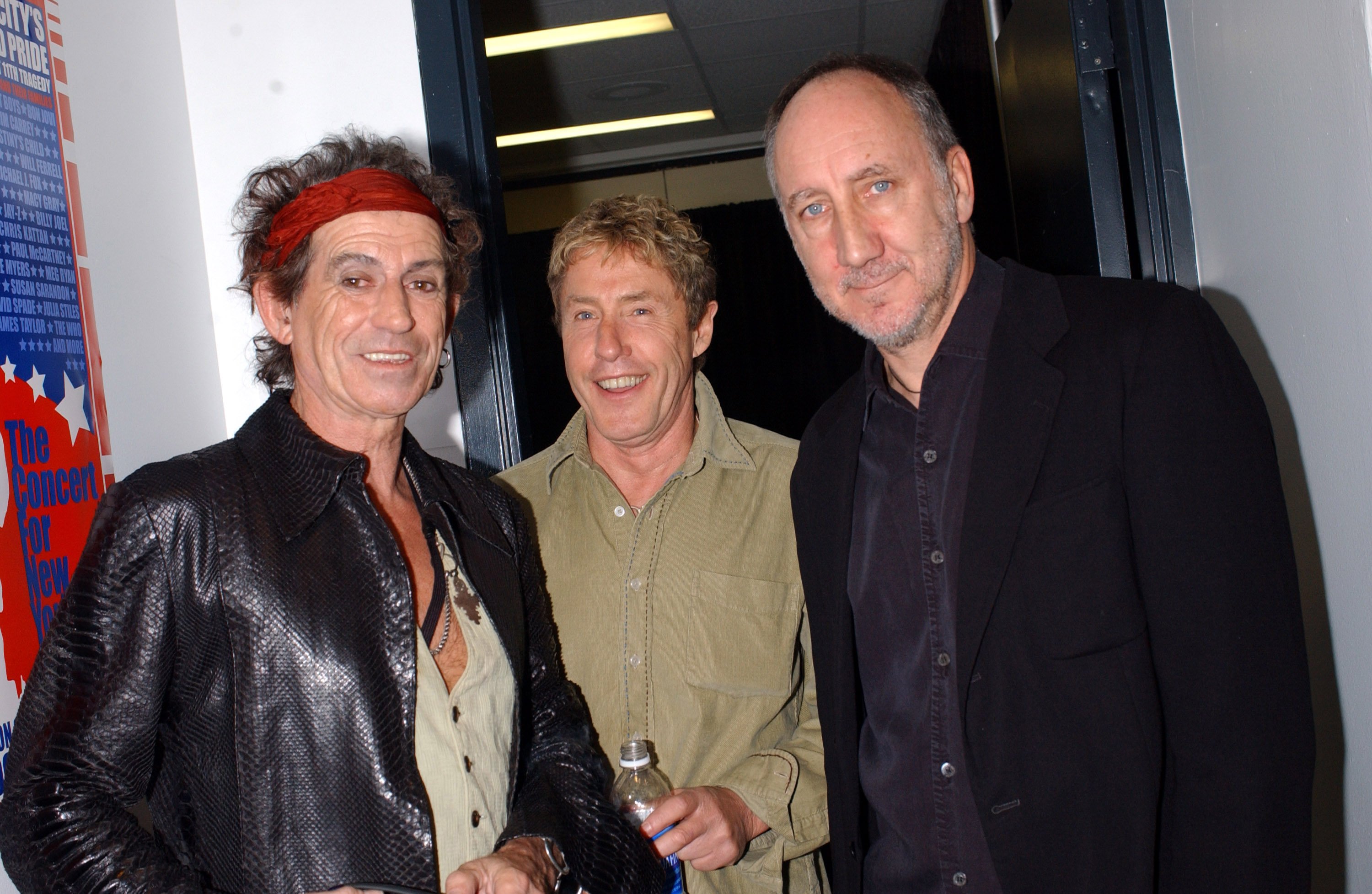 Keith Richards of The Rolling Stones backstage with Roger Daltrey and Pete Townshend of The Who