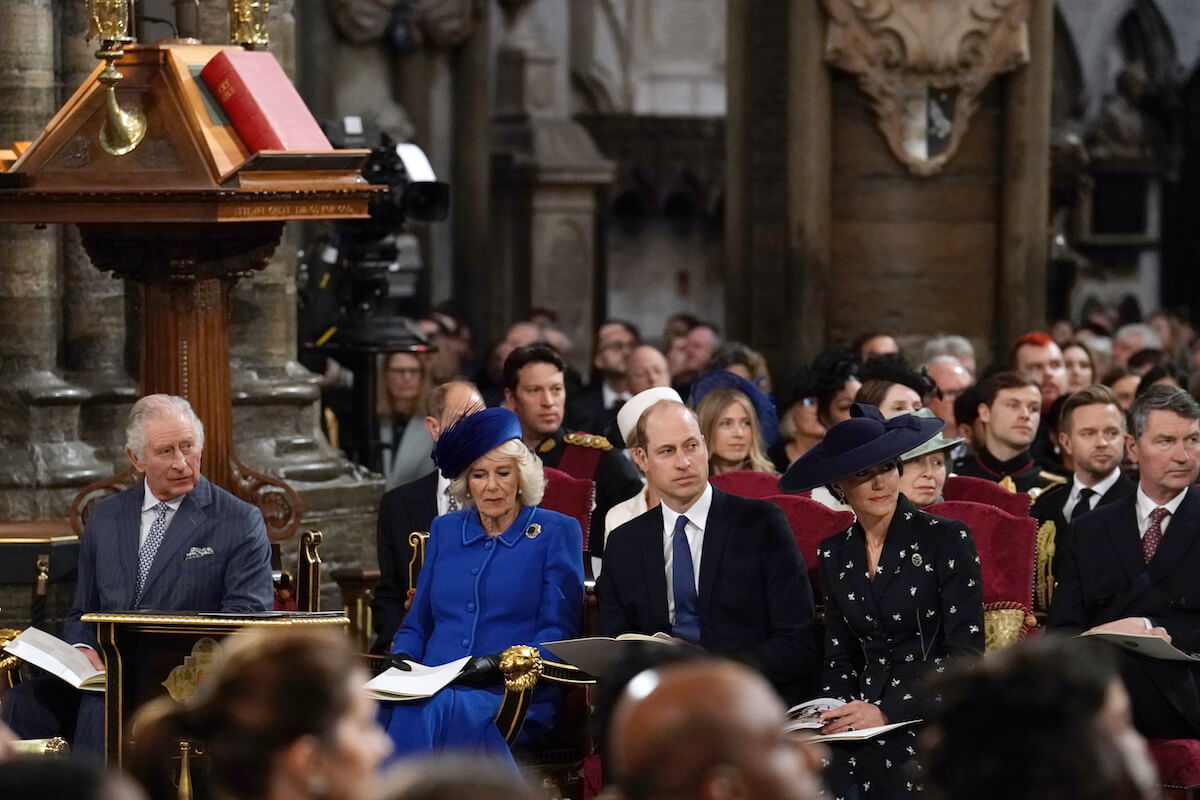 King Charles III, Camilla Parker Bowles, Prince William, and Kate Middleton sit at Westminster Abbey where Prince Harry will have no official coonation role