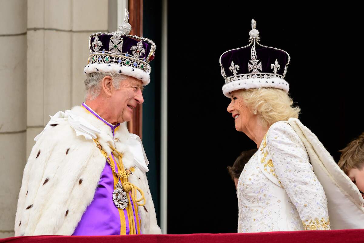 During the Coronation, King Charles III and Queen Camilla smile at each other on the balcony of Buckingham Palace