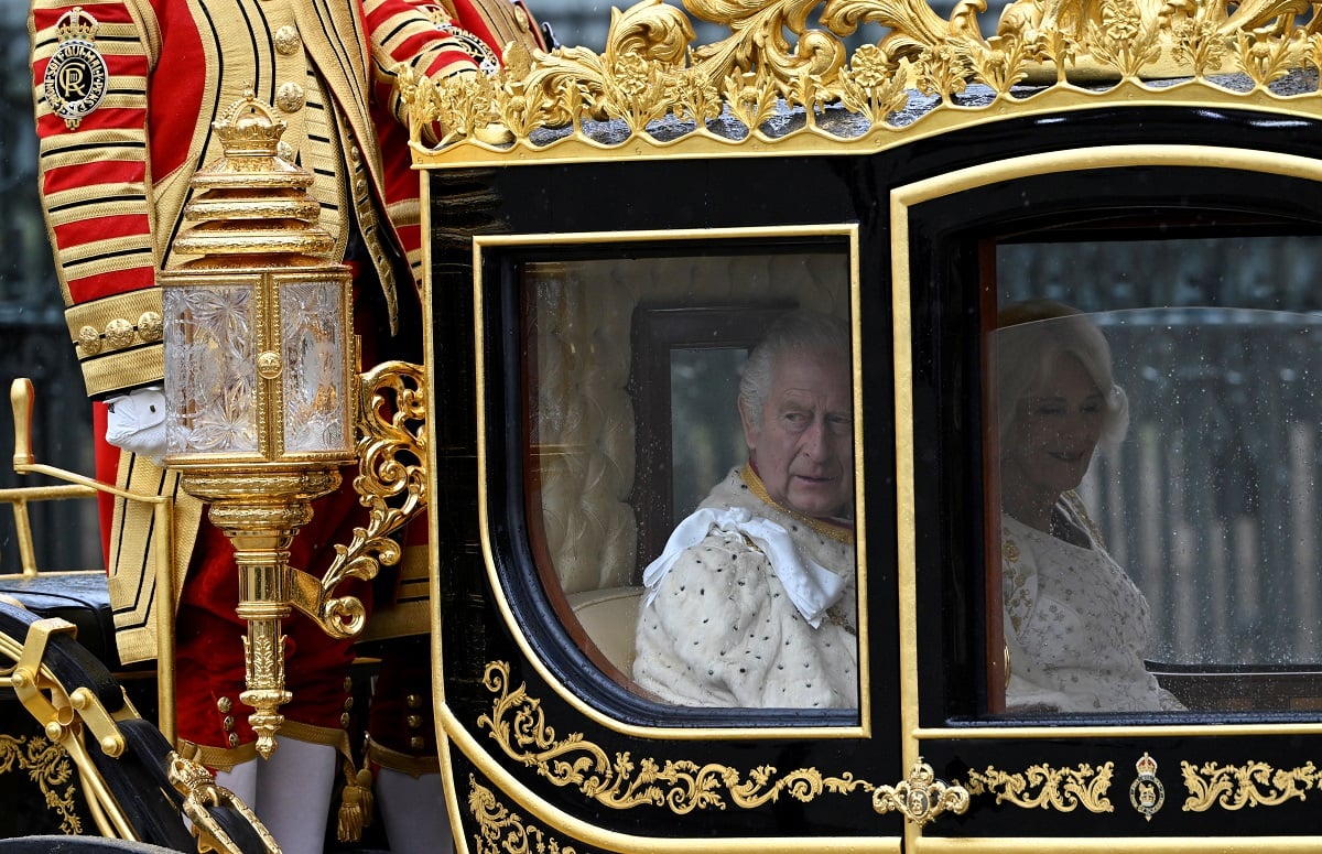 King Charles III and Queen Camilla arrive in the Diamond Jubilee State Coach from Buckingham Palace to Westminster Abbey