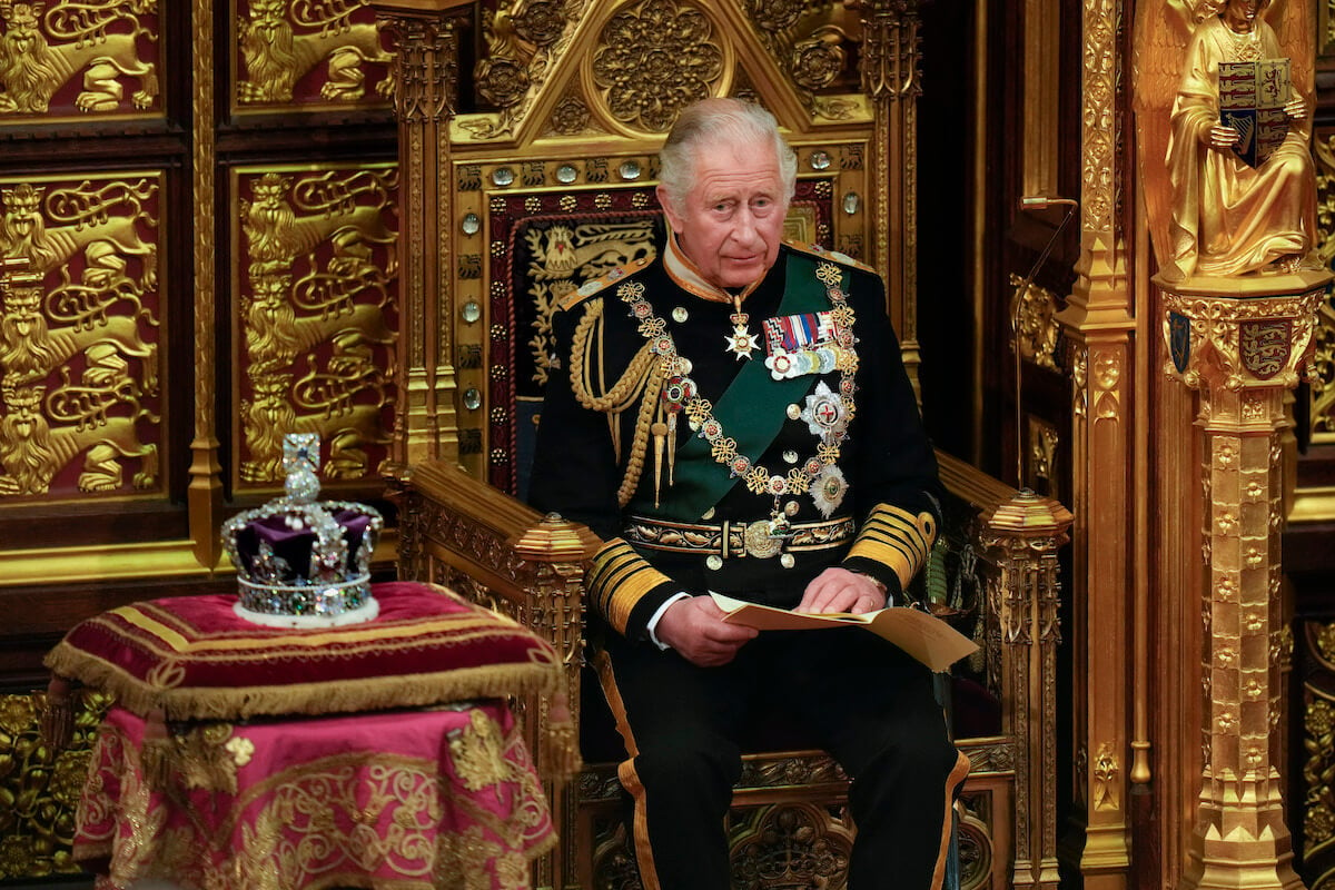 King Charles III, who switched coronation crowns, sits next to the Imperial State Crown