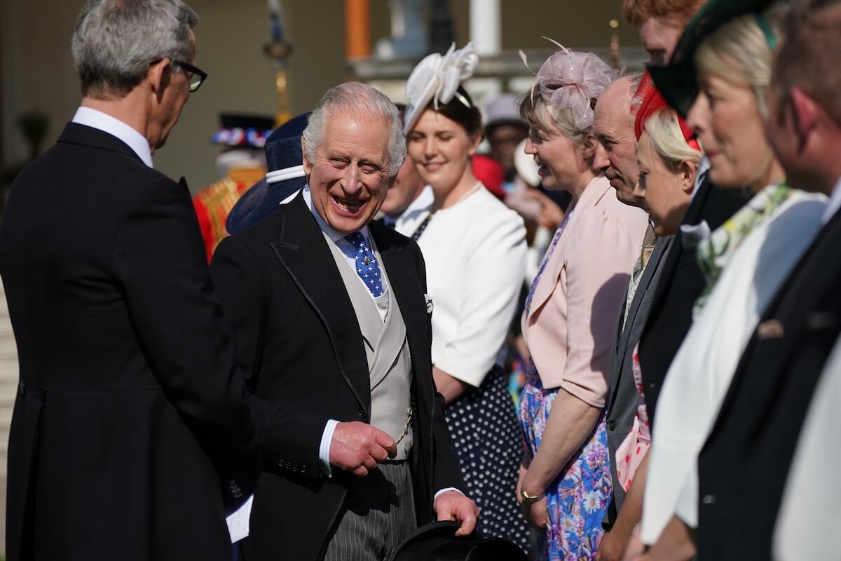King Charles III, whose coronation dress code may be ignored, greets guests