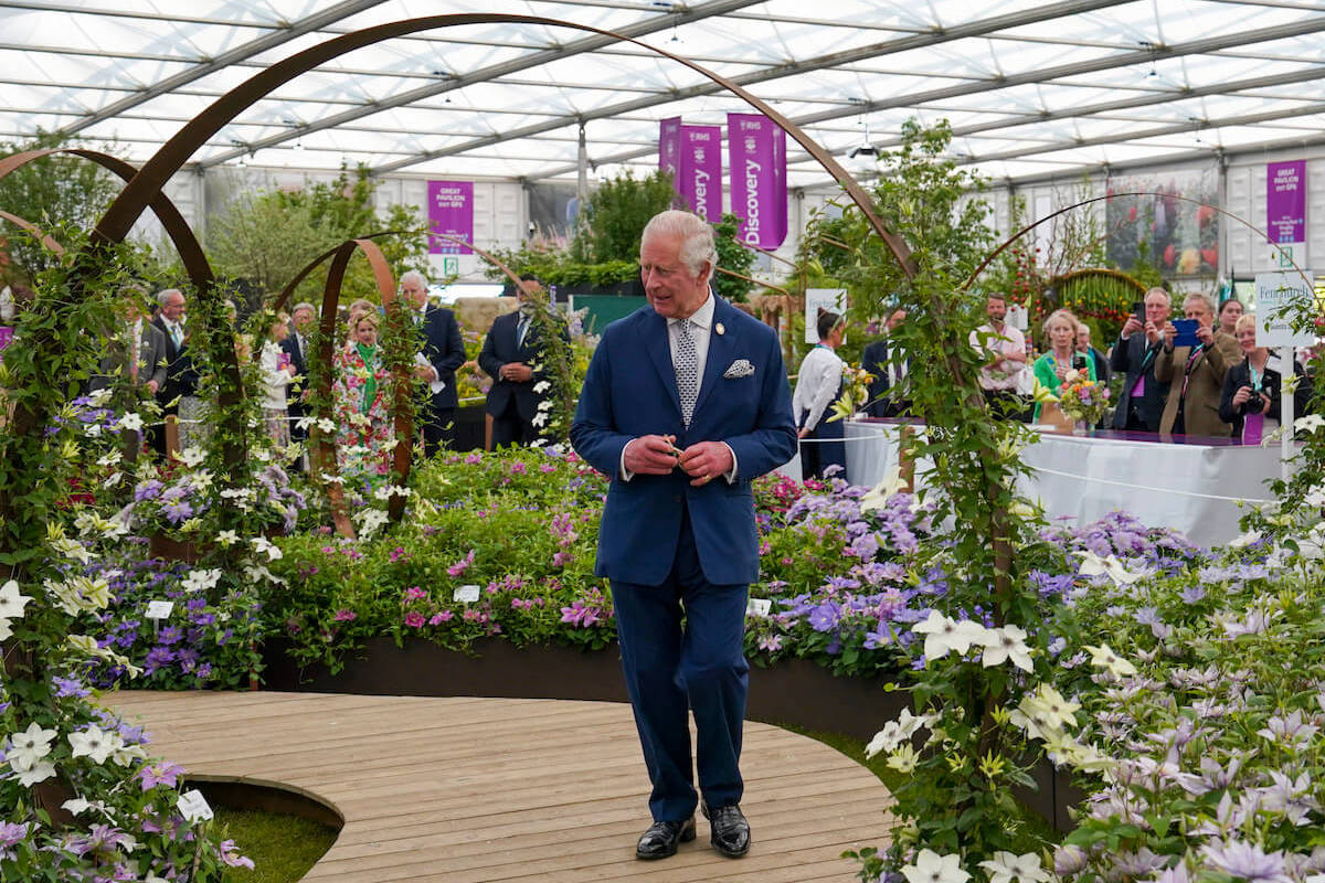King Charles at the 2023 Chelsea Flower Show, which had royal photographers breaking royal protocol with Kate Middleton's surprise appearance