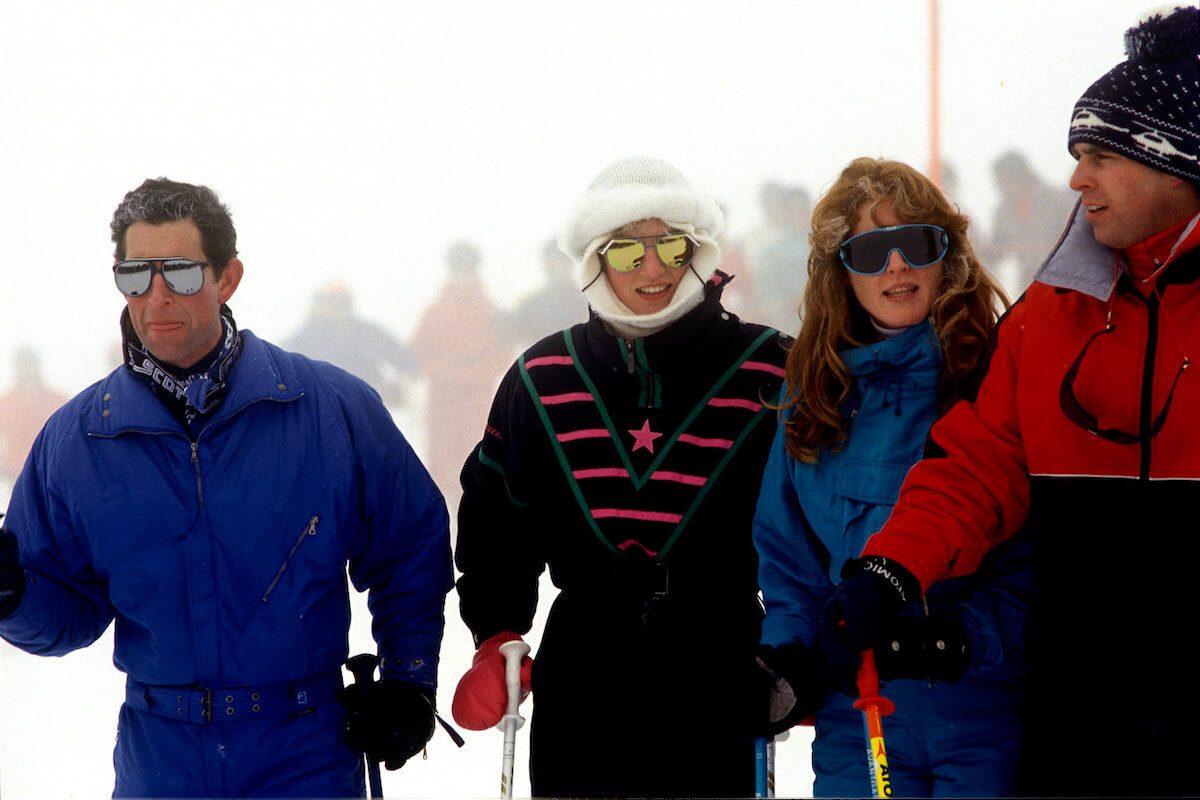 King Charles, who appeared 'irritated' when Princess Diana joked with Sarah Ferguson during a 1987 photocall, stands next to Princess Diana, Sarah Ferguson, and Prince Andrew during a skiing vacation