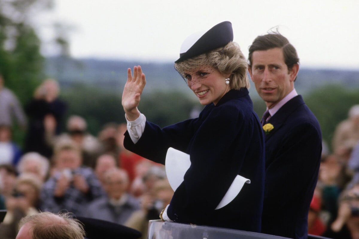 King Charles, who didn't share in Princess Diana and Sarah Ferguson's joke during a ski vacation photocall, sits next to Princess Diana as she waves