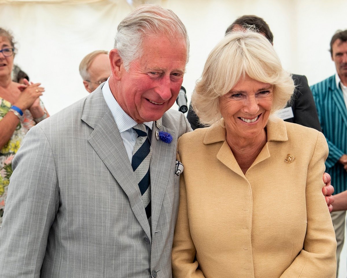 King Charles, who gets hugs from Kate Middleton and Zara Tindall, hugs Camilla Parker Bowles as they attend a celebration of the 70th anniversary of the National Parks