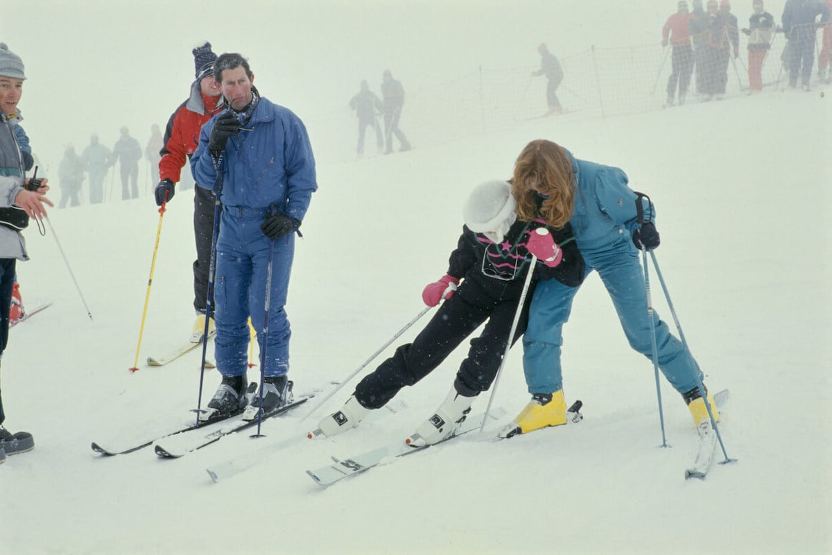 King Charles, who was 'irritated' by Princess Diana's joke with Sarah Ferguson during a photocall, looks on alongside Prince Andrew