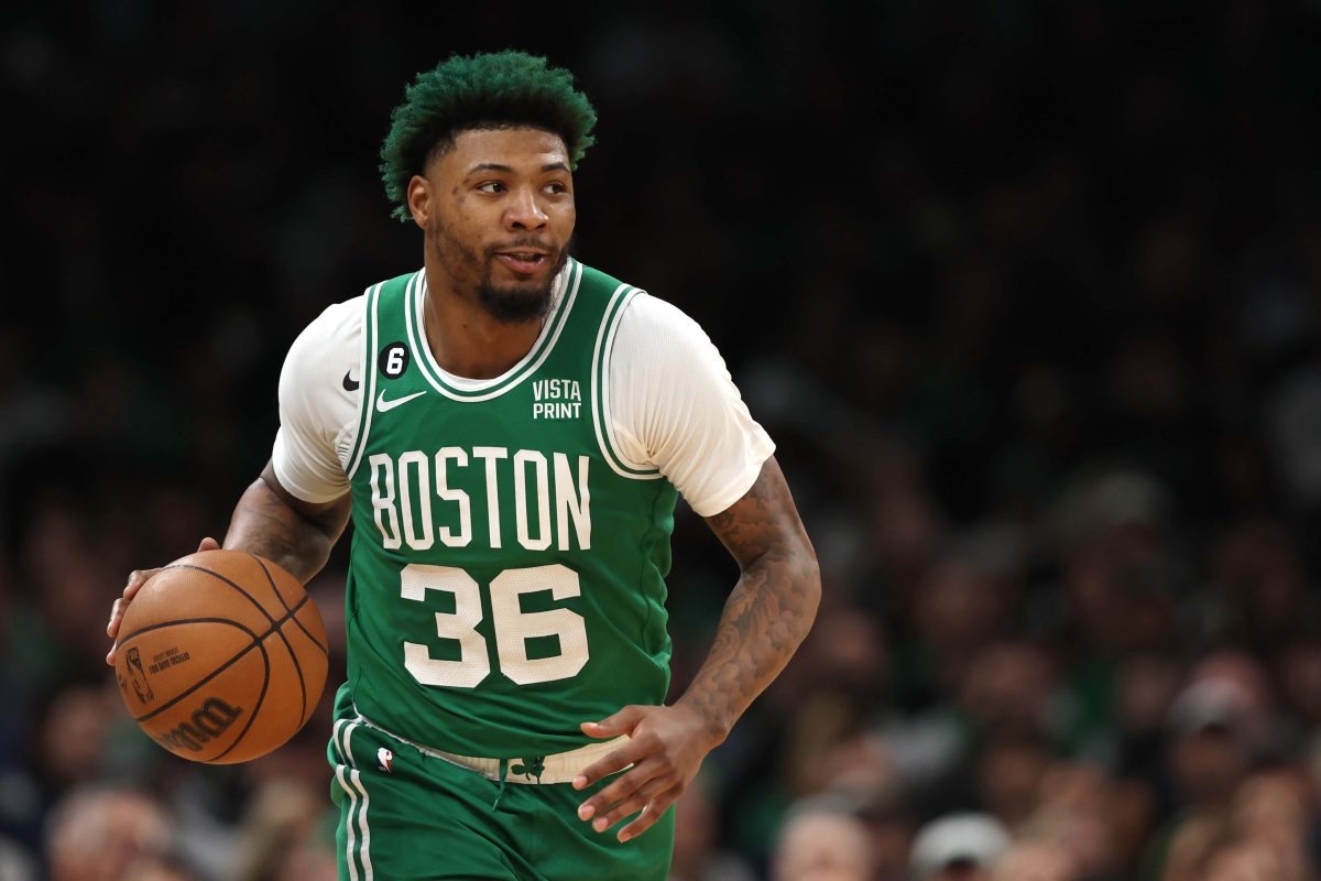 Marcus Smart, who's fiancee is Maisa Hallum, dribbles downcourt during a playoff game at TD Garden