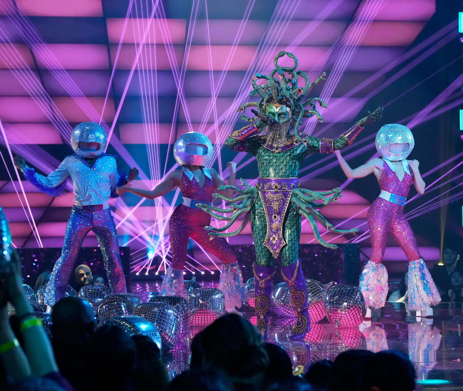 Medusa in 'The Masked Singer' Season 9 singing on stage with backup dancers