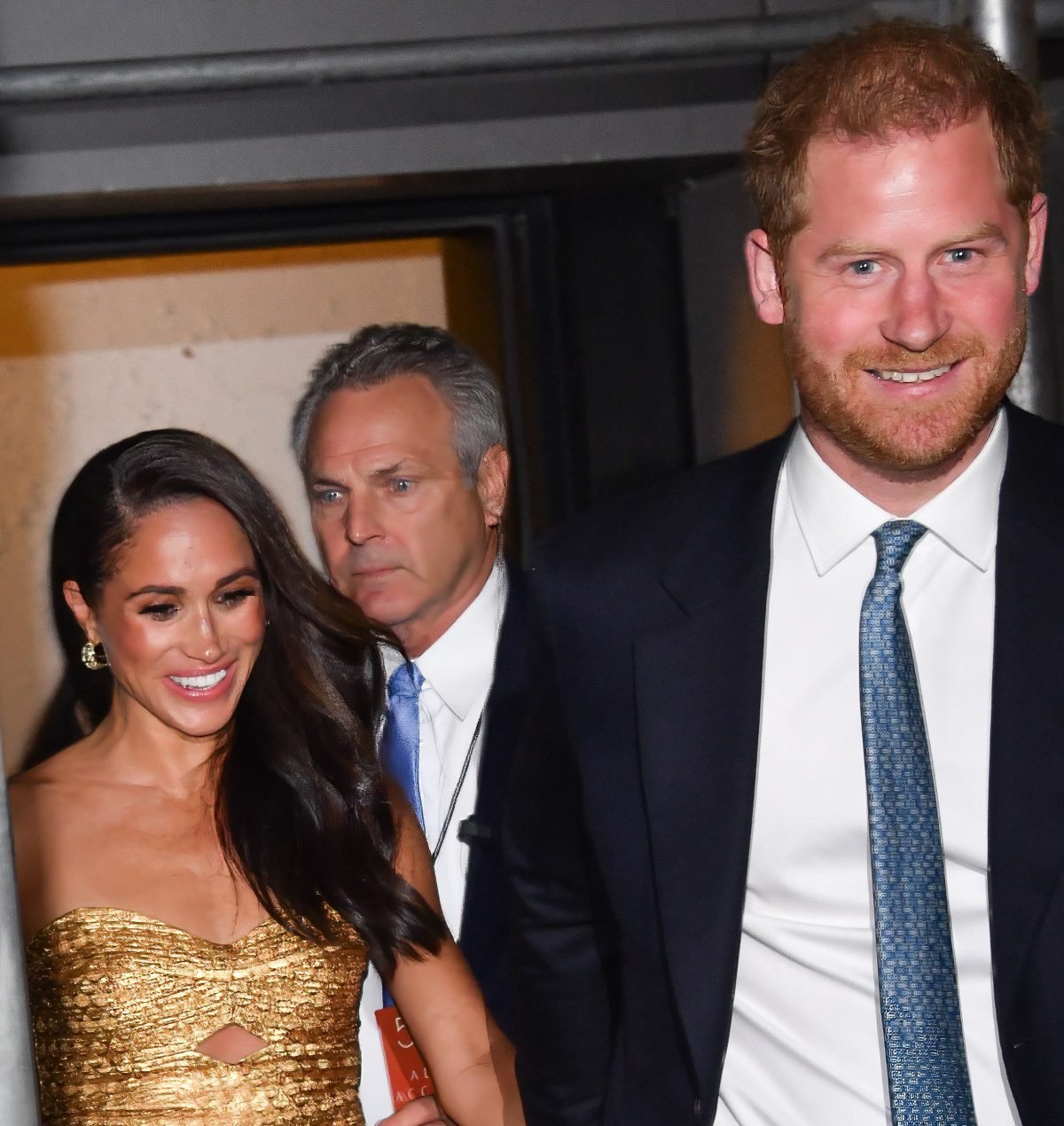Meghan Markle and Prince Harry smiling as they leave The Ziegfeld Theatre