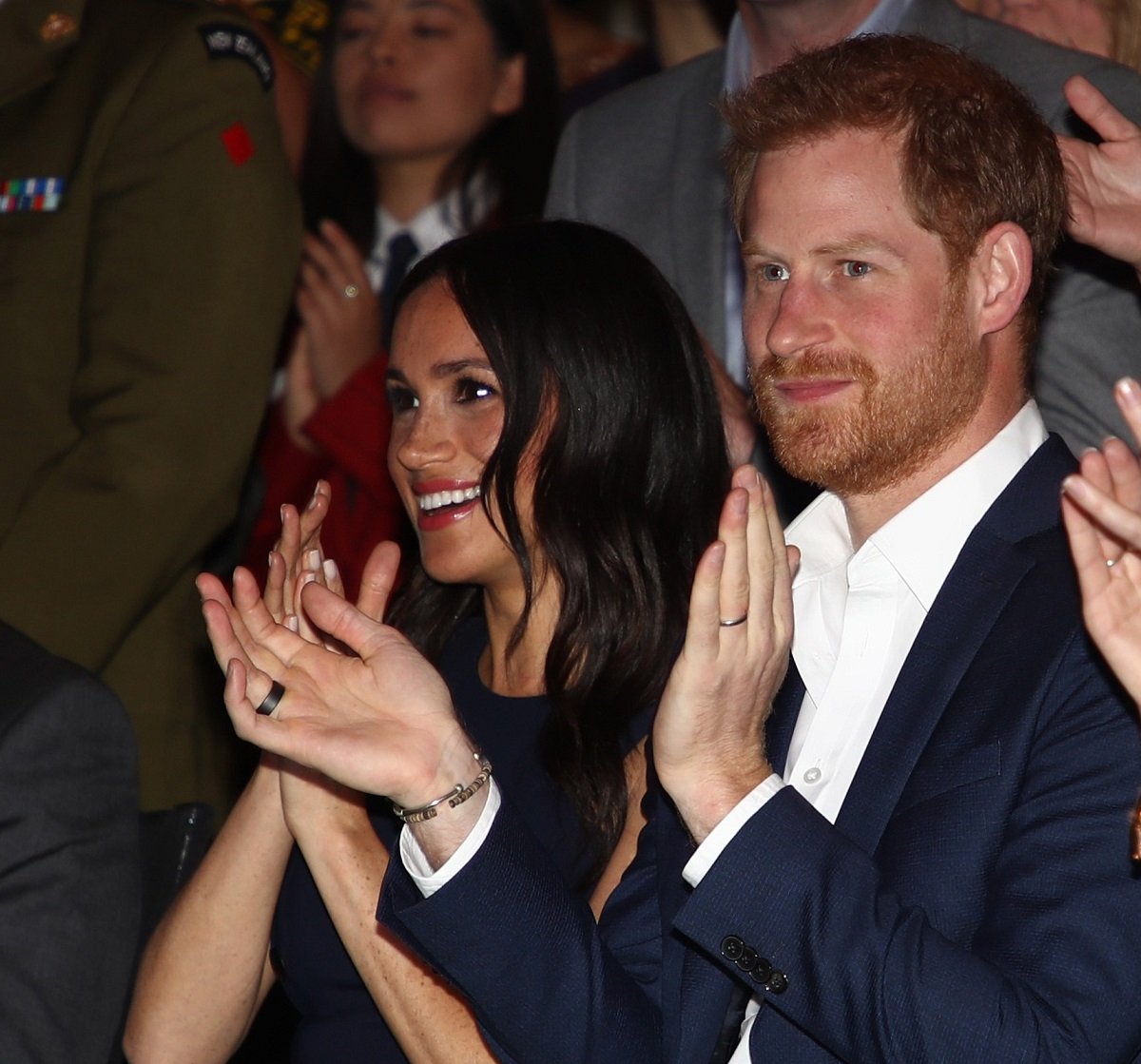 Meghan Markle and Prince Harry watch a cultural performance as they attend the Auckland War Memorial Museum