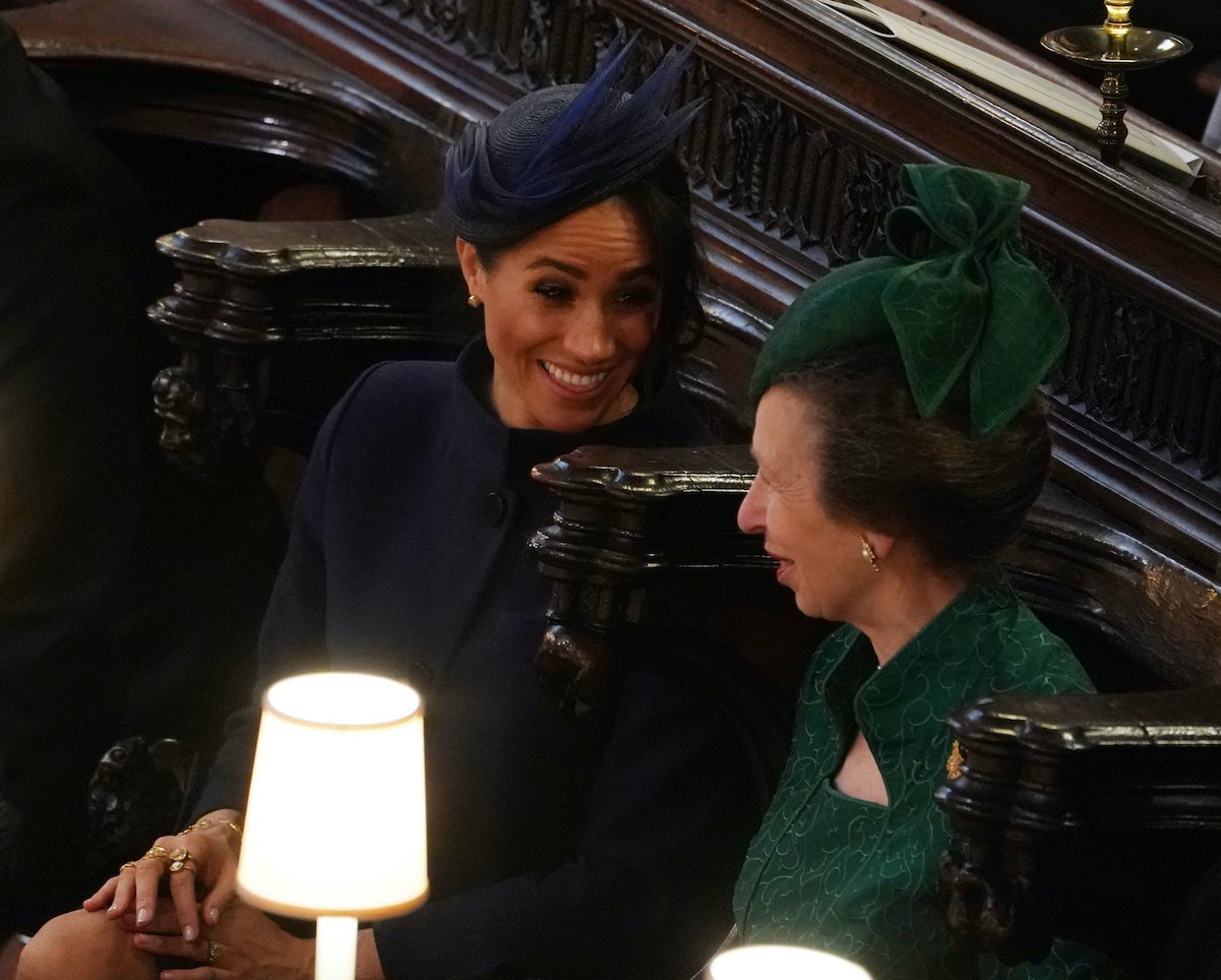 Meghan Markle and Princess Anne exchange laughs at Princess Eugenie's wedding in 2018