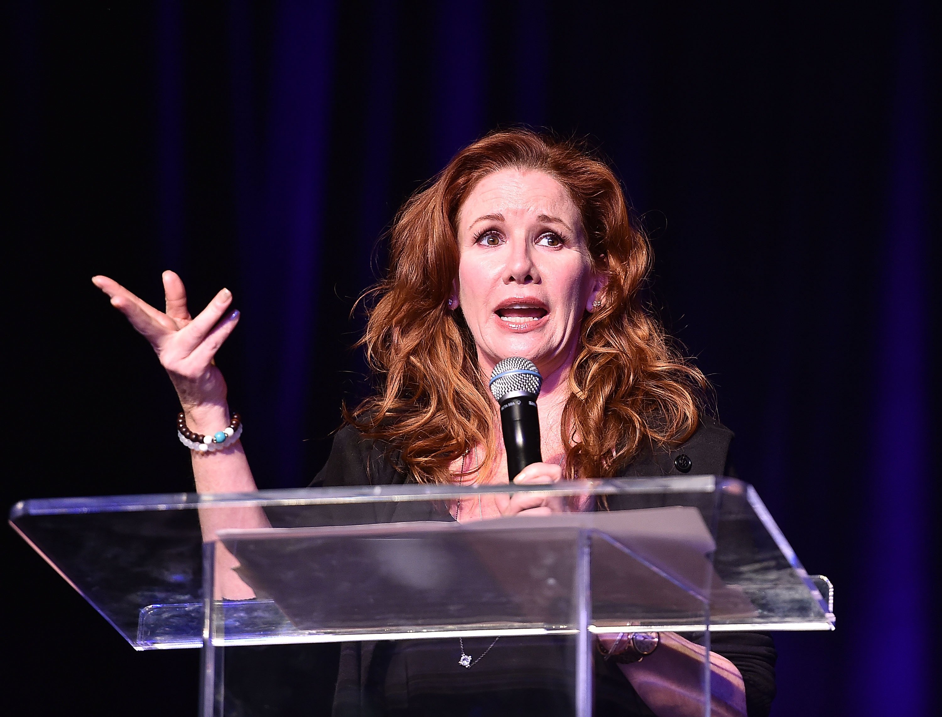 Melissa Gilbert speaking at a podium