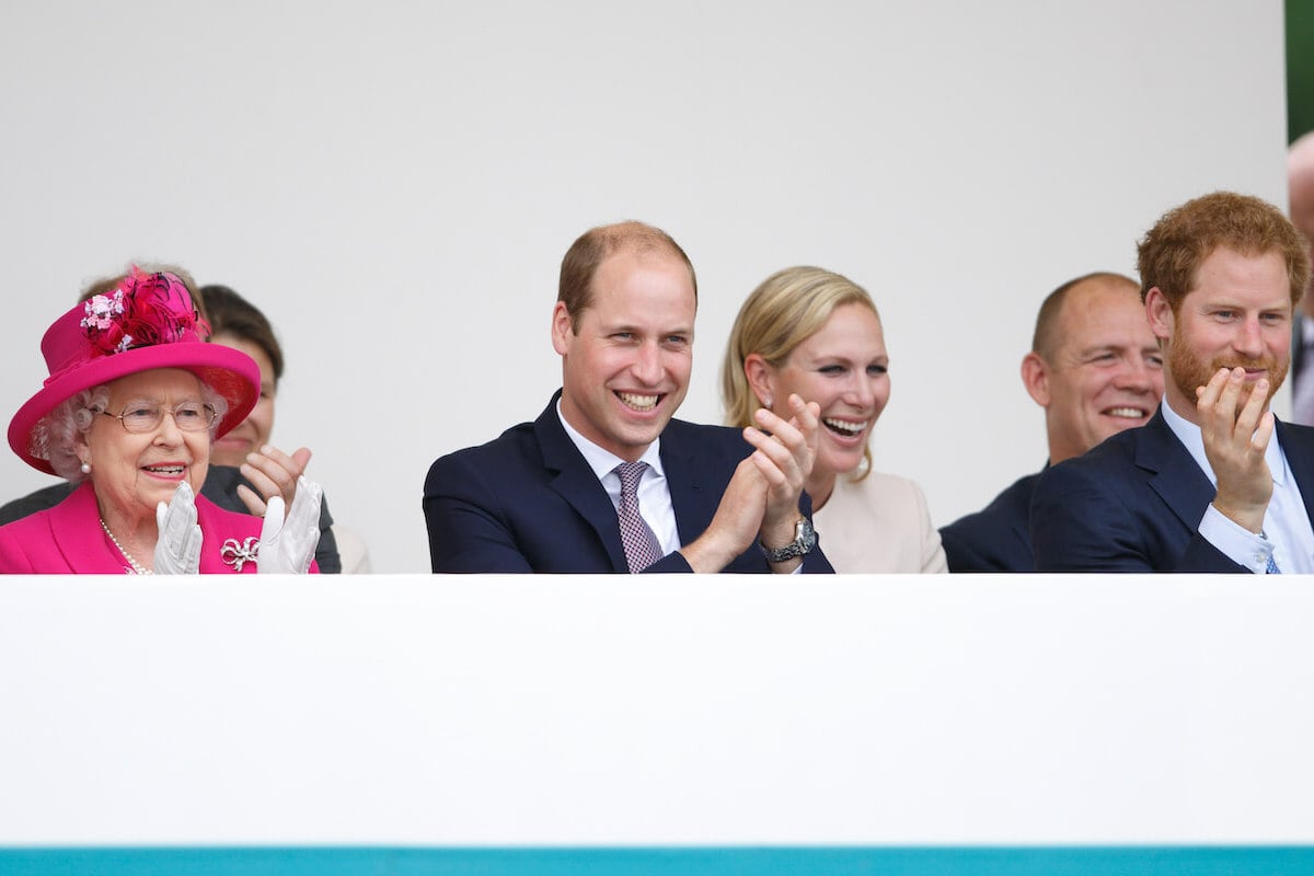 Mike Tindall, who, per a body language expert, joined the royal family 'already a hero' to Prince William and Prince Harry, sits behind the brothers and Queen Elizabeth II with Zara Tindall