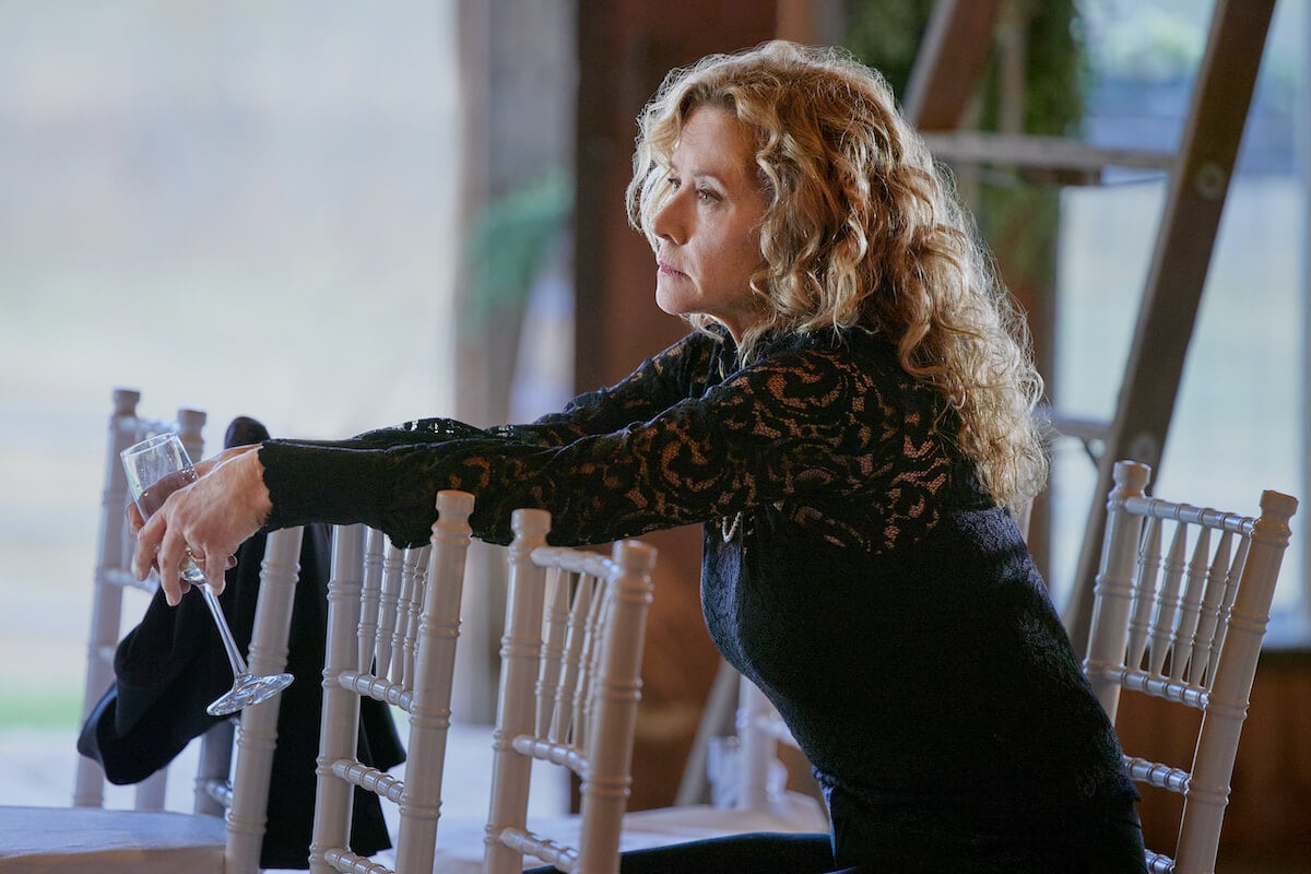 Nancy Travis as Isabel, leaning on a chair, in 'Ride' on Hallmark Channel